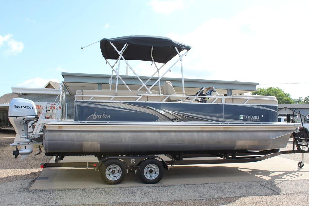 2021 Avalon VLS Quad Lounge 22 FT pontoon boat with Honda outboard motor.