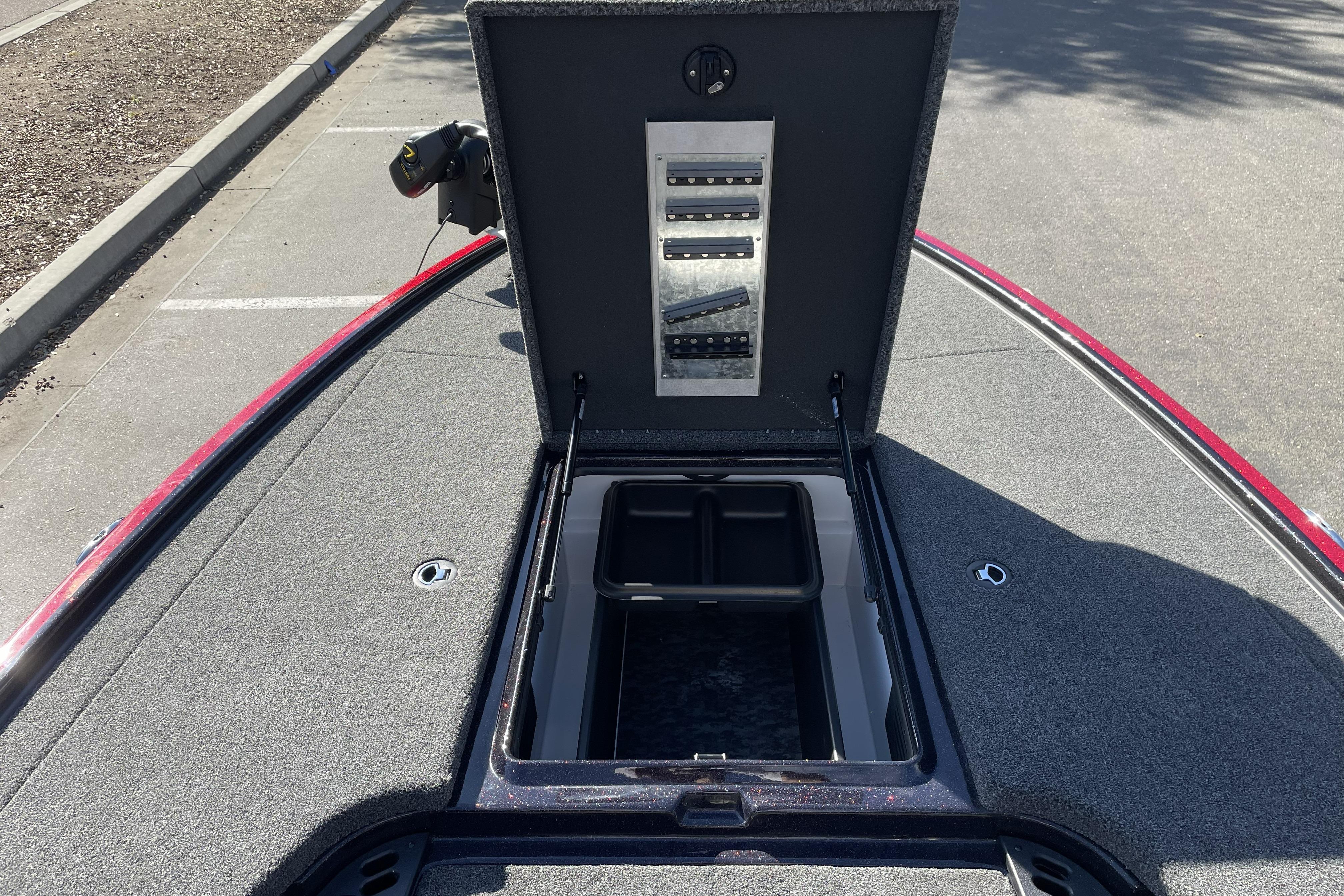 Open storage compartment on 2026 Nitro Z19 XL boat, showcasing interior features.