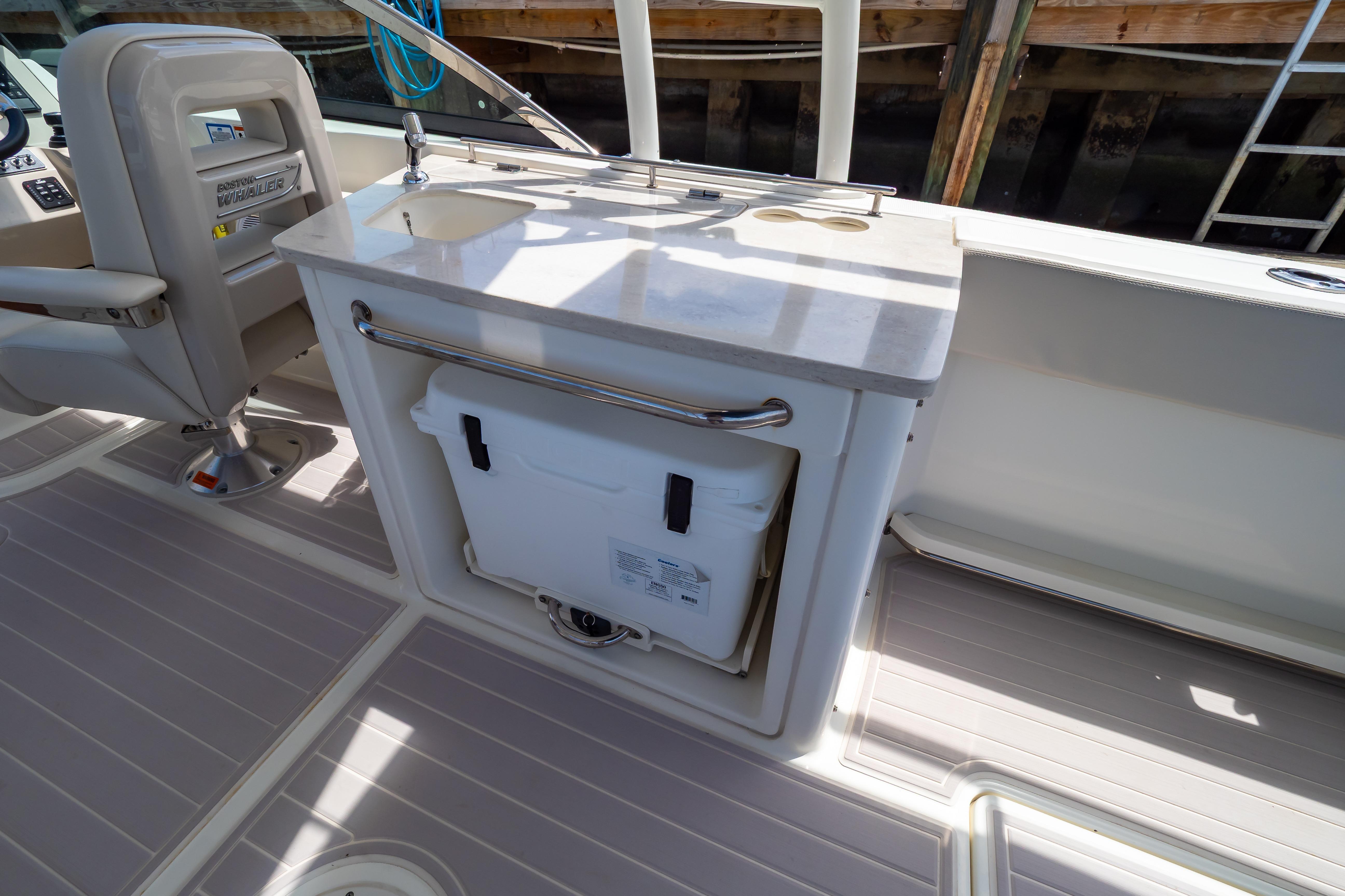 2019 Boston Whaler 270 Vantage interior with seating and storage area.