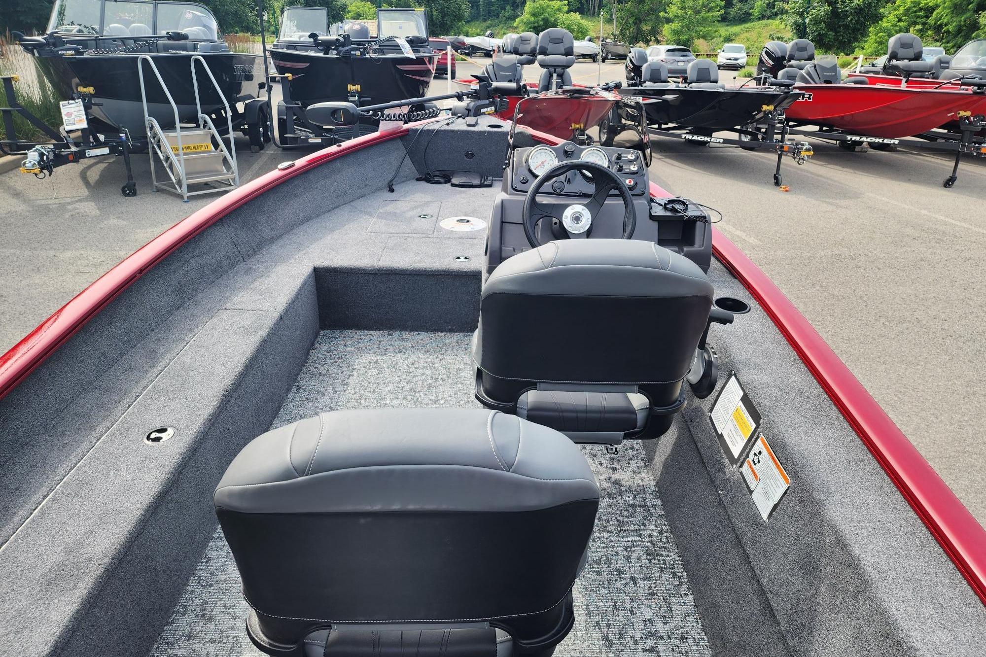 2026 Tracker Super Guide V-16 SC boat interior with dual seats and steering console.