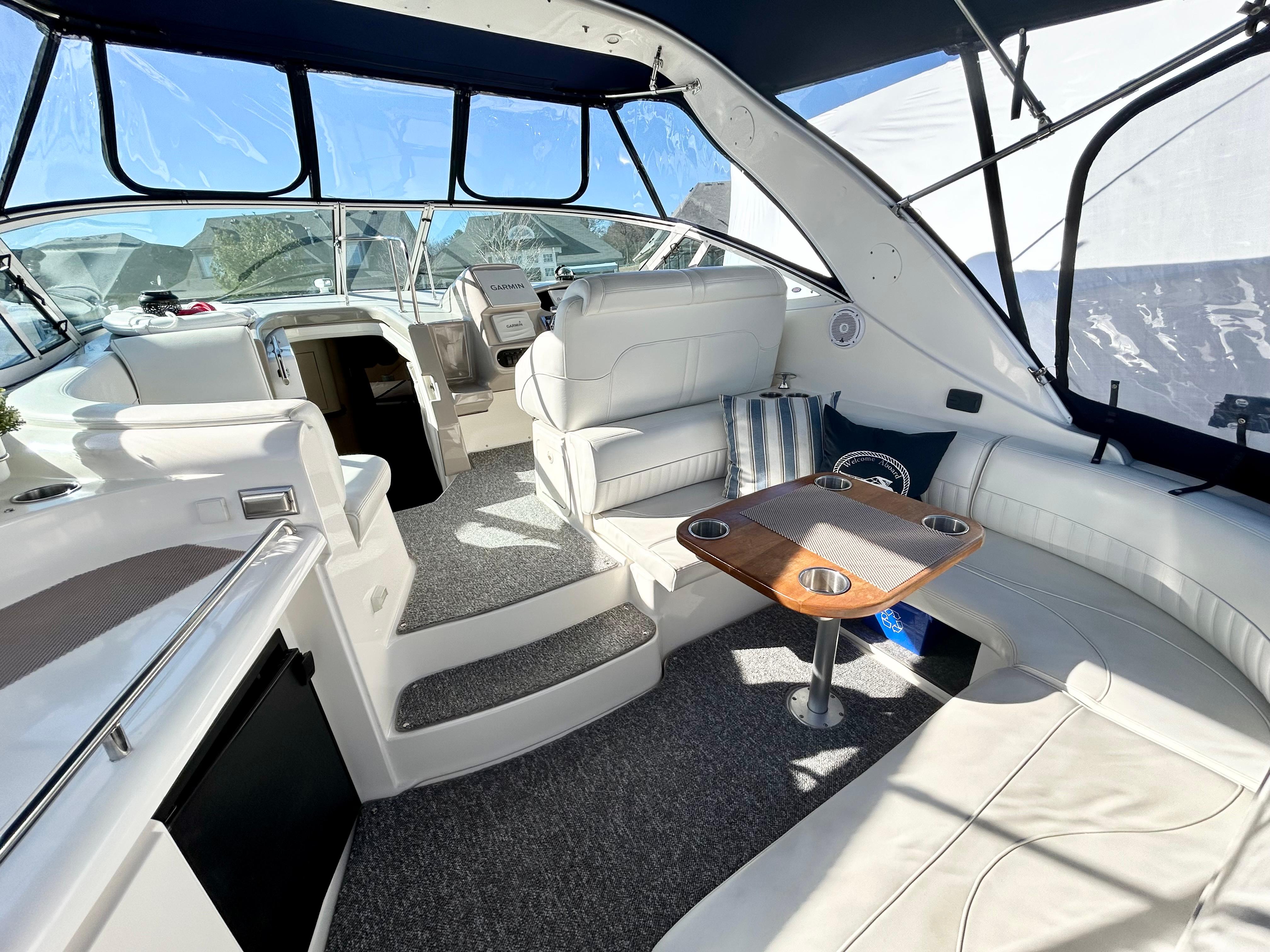 Interior of a 2003 Cruisers Yachts 3470 Express with seating area.