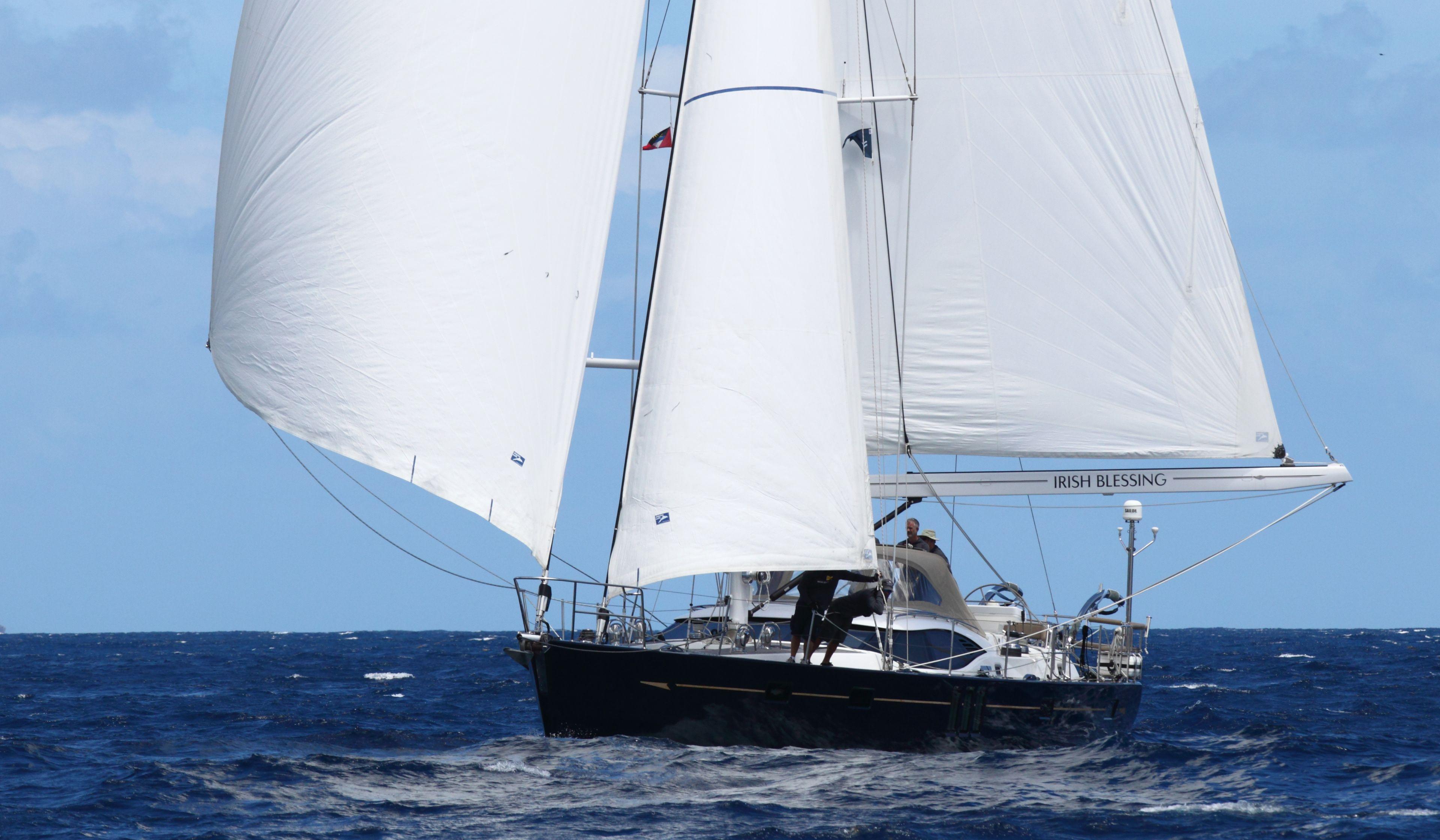 Sailing yacht Oyster 625, 2016 model, navigating open sea with full sails.