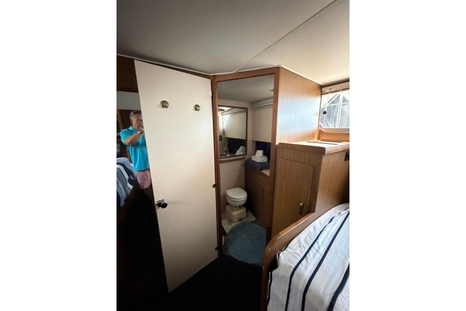 Interior of 1980 Chris-Craft 381 Catalina yacht showing bathroom and cabin area.