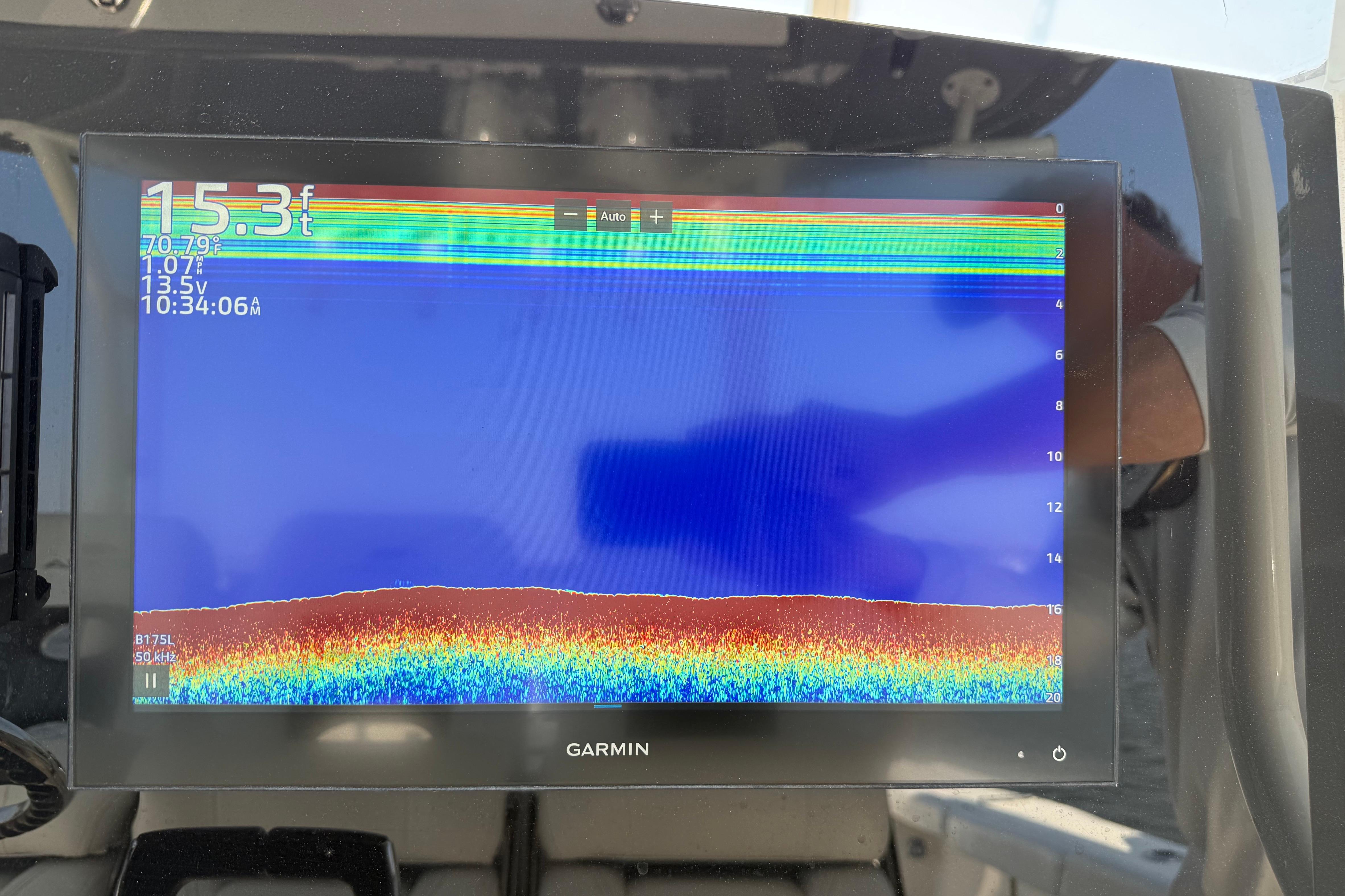 Garmin fishfinder display on 2023 Cobia 350 Center Console, showing depth and temperature.