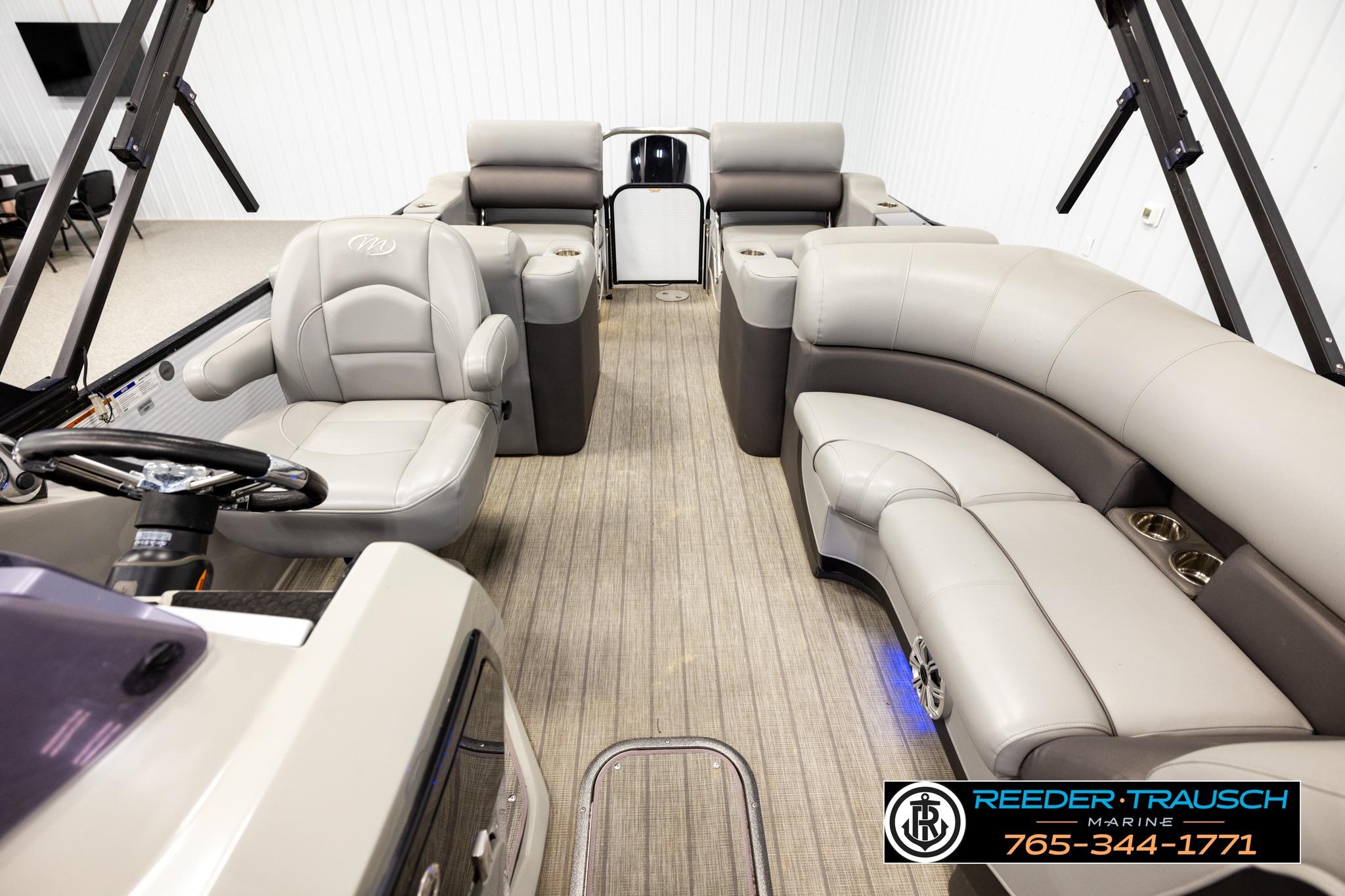 2019 Manitou Oasis SR VP pontoon boat interior with plush seating and modern design.