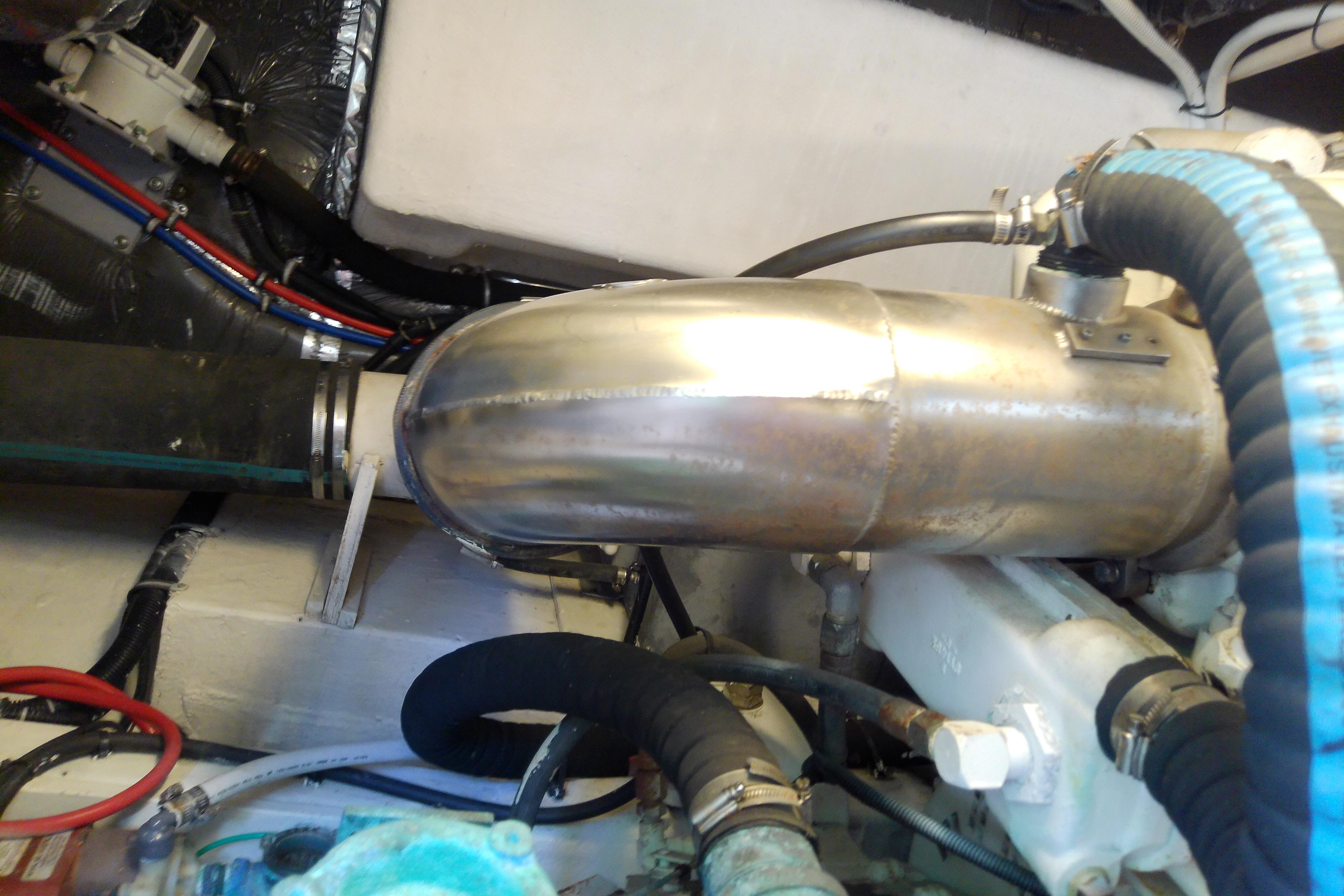 Engine compartment of a 2000 Tiara Yachts 4100 Open, showcasing exhaust system components.