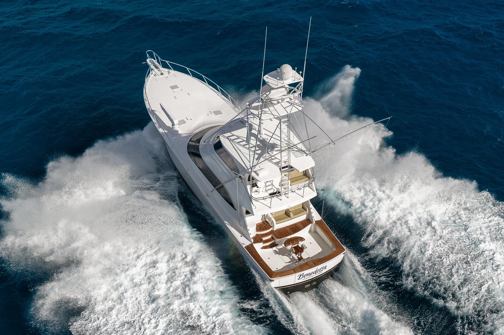 Aerial view of 2012 Viking 70 Enclosed Bridge yacht cruising through ocean waves.