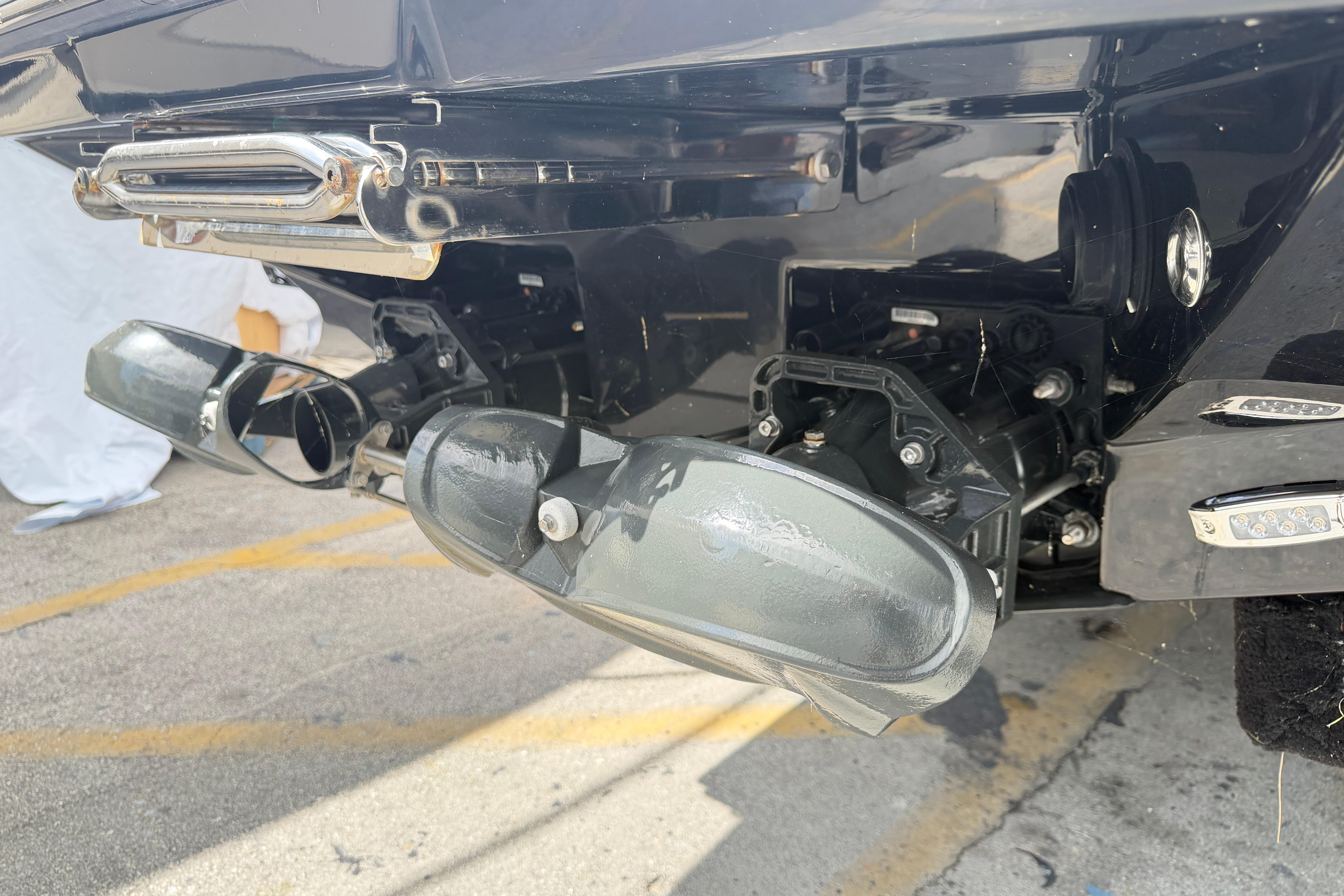 Rear view of a 2026 Scarab 235 LX boat's propulsion system and exhaust.