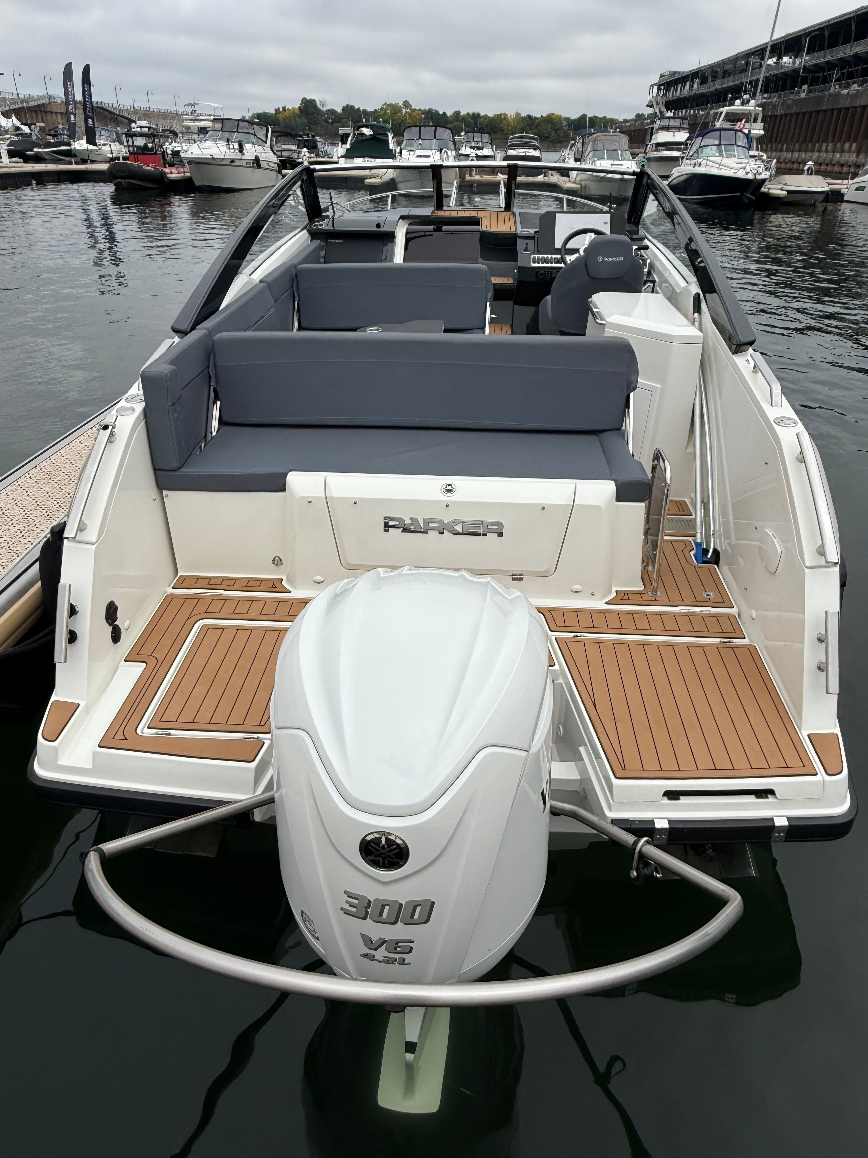 The image shows a 2022 Parker Poland 800 Cruiser docked, featuring a Yamaha engine.