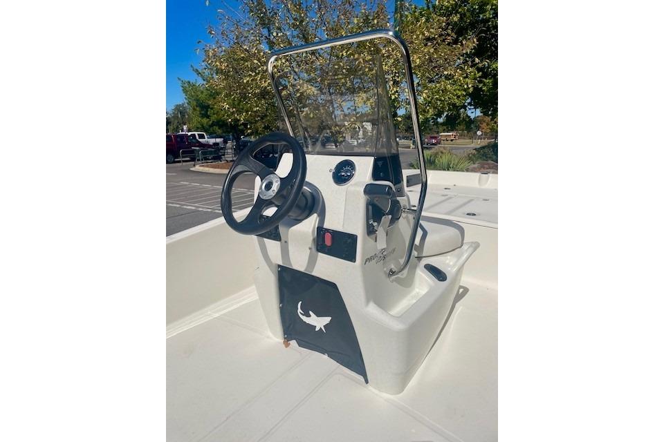 2026 Mako Pro Skiff 15 CC boat console with steering wheel and controls.