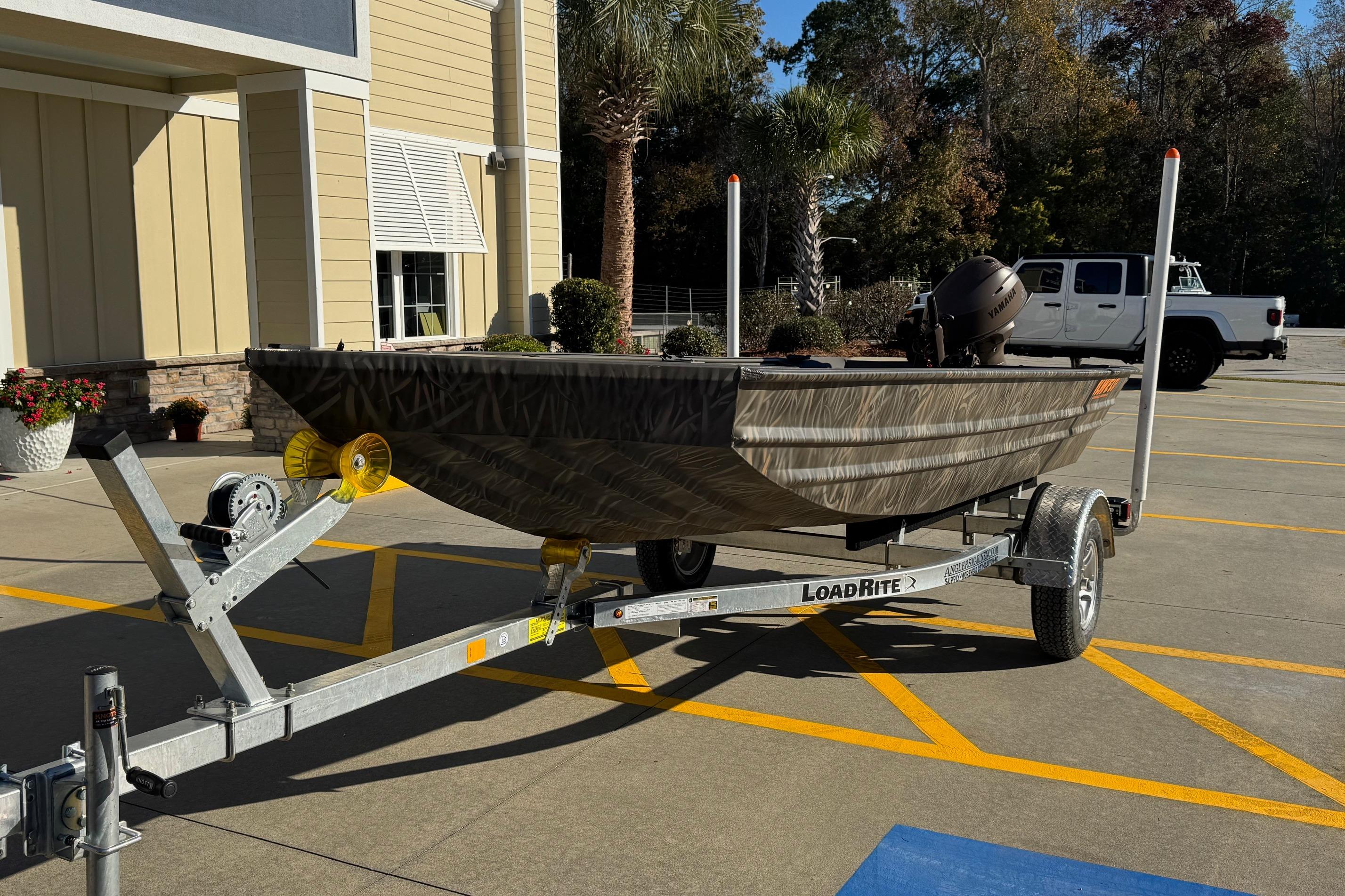 2026 Alweld 1652VV Marsh boat on Load Rite trailer in parking lot.