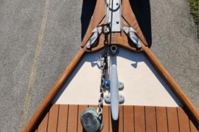 1985 Wasque Down East Cruiser bow with anchor and wooden deck details.