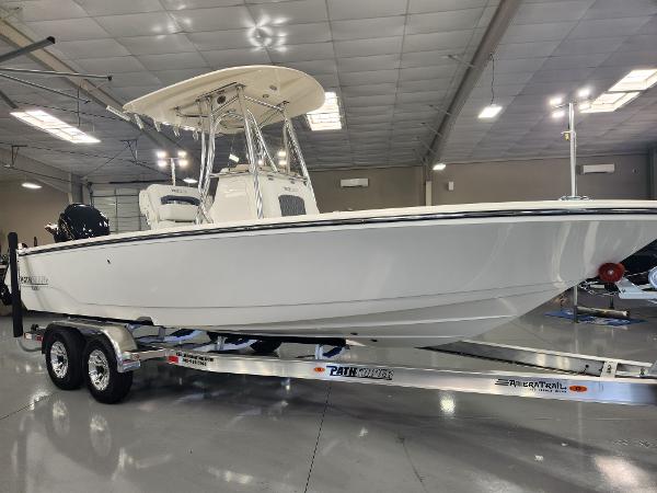 2025 Pathfinder 2400 Open boat on trailer in showroom.