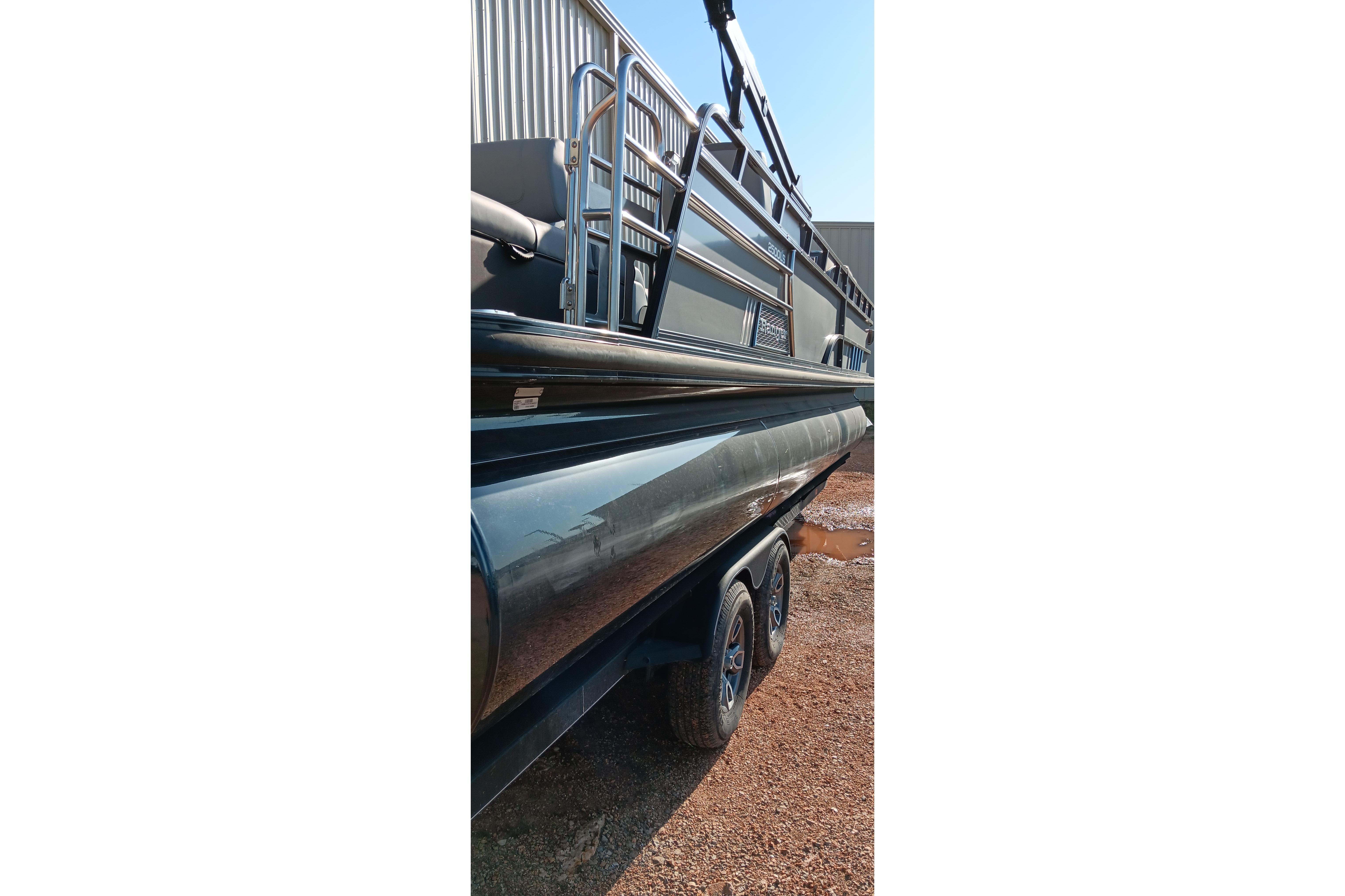 2023 Ranger 2500LS pontoon boat on trailer, side view.