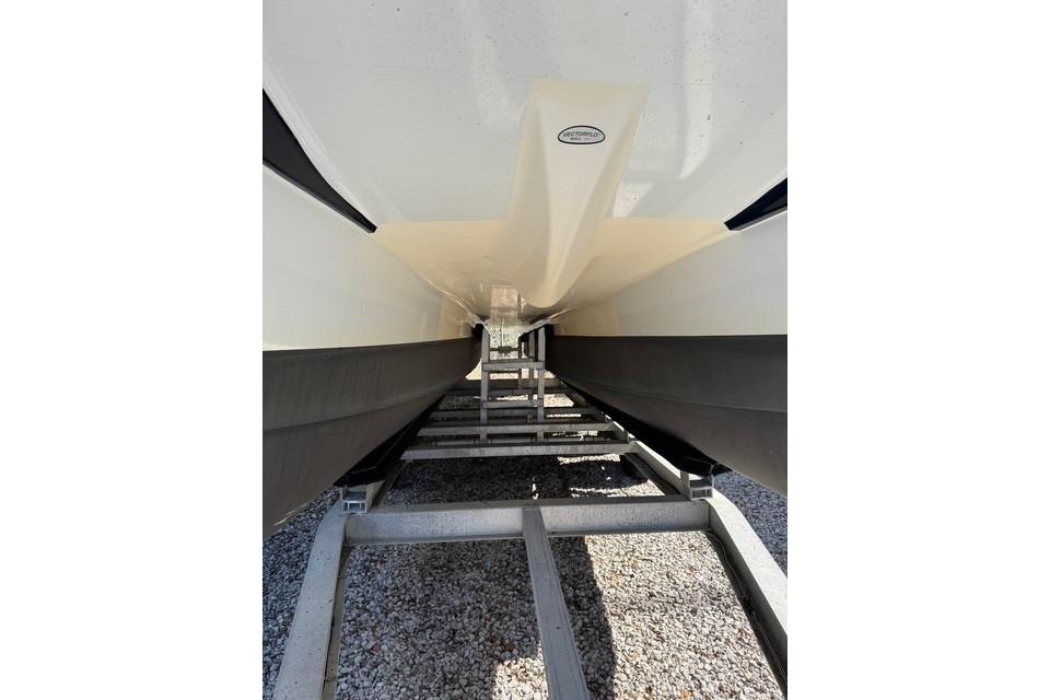 Underneath view of a 2003 World Cat 270 EC boat on a trailer.