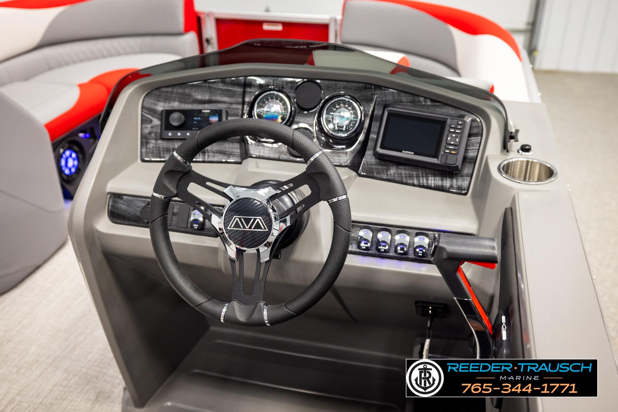 Interior view of 2026 Avalon LSZ QL boat dashboard with steering wheel and controls.