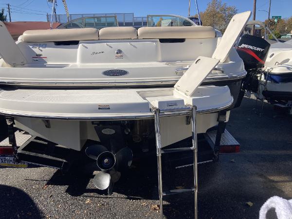2008 Chaparral 210 SSi boat rear view with swim platform and ladder.