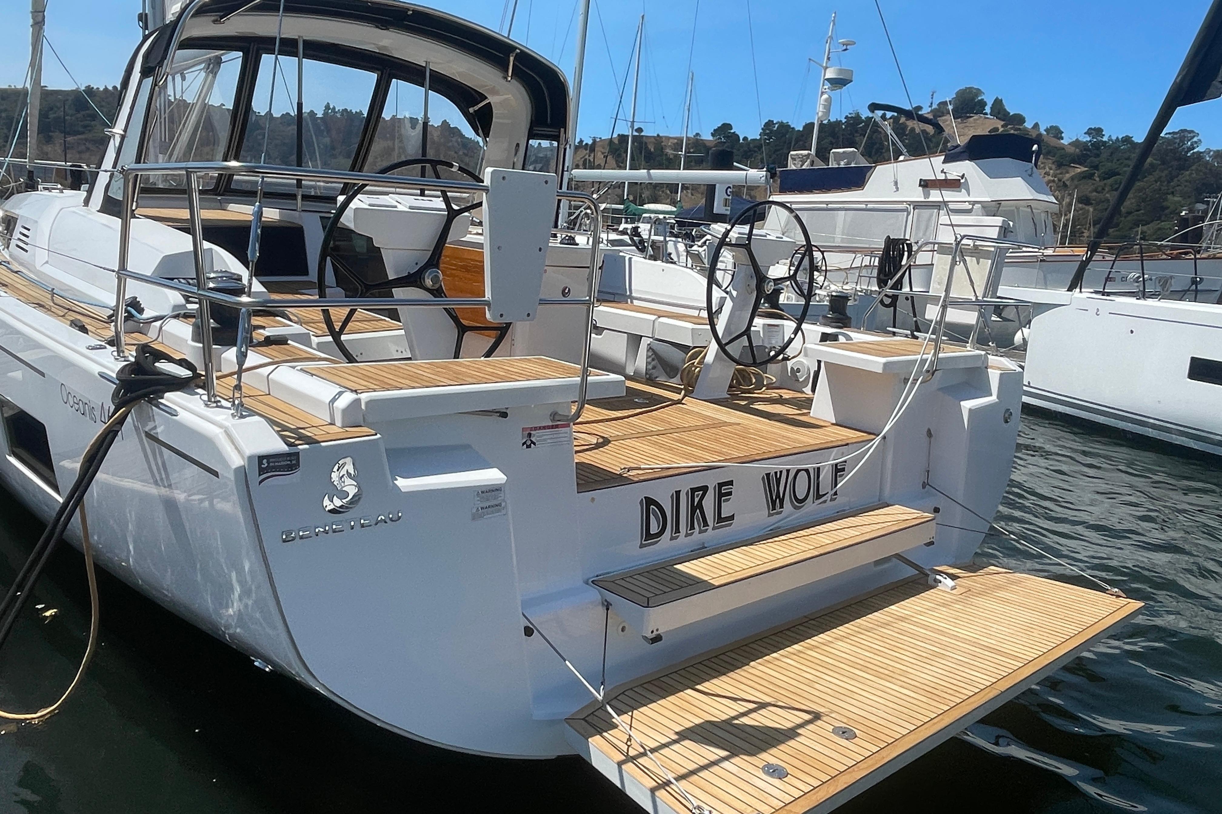 2020 Beneteau Oceanis 46.1 yacht "Dire Wolf" docked at marina, rear view.