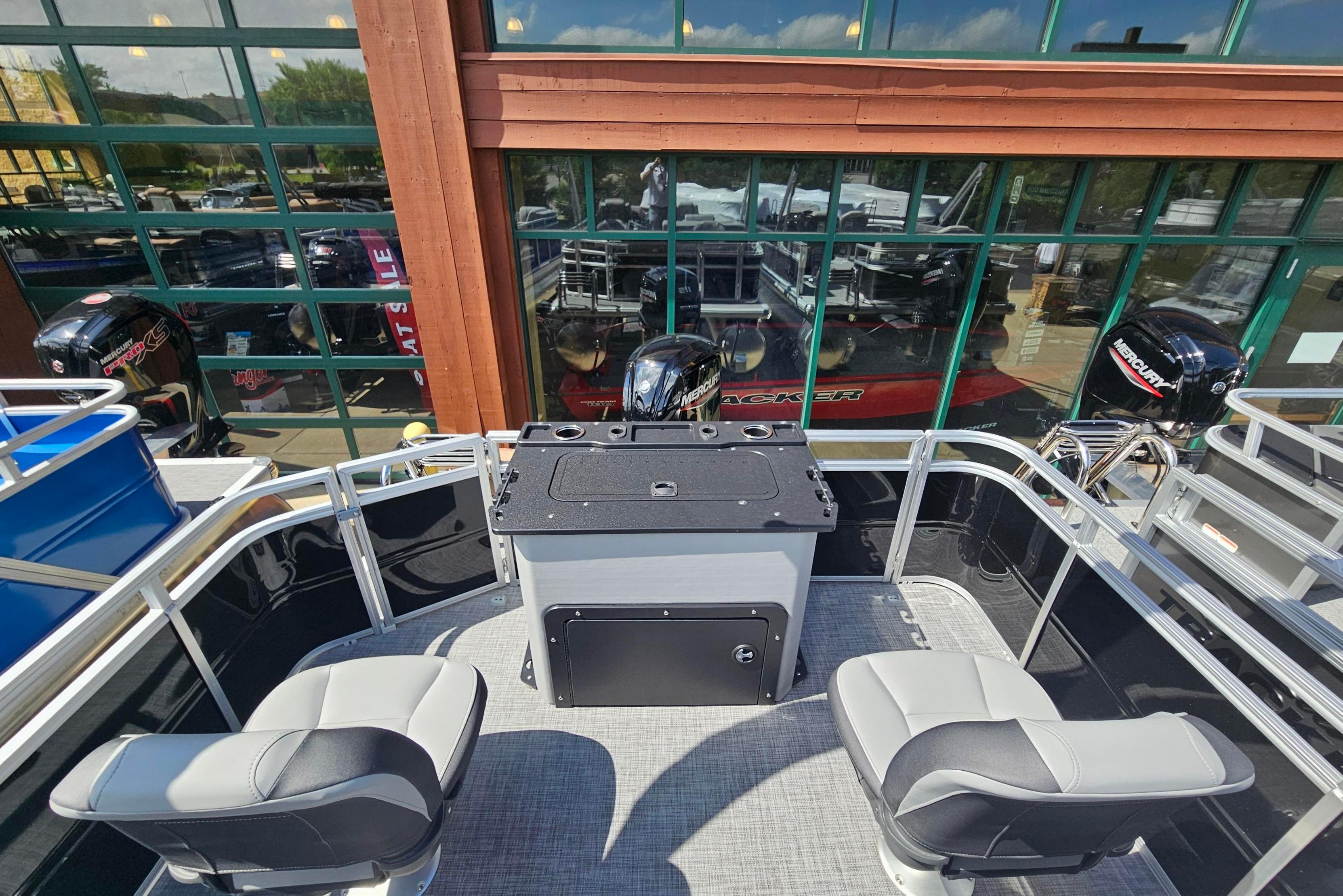 2026 Sun Tracker Party Barge 22 RF DLX interior with seating and control panel.