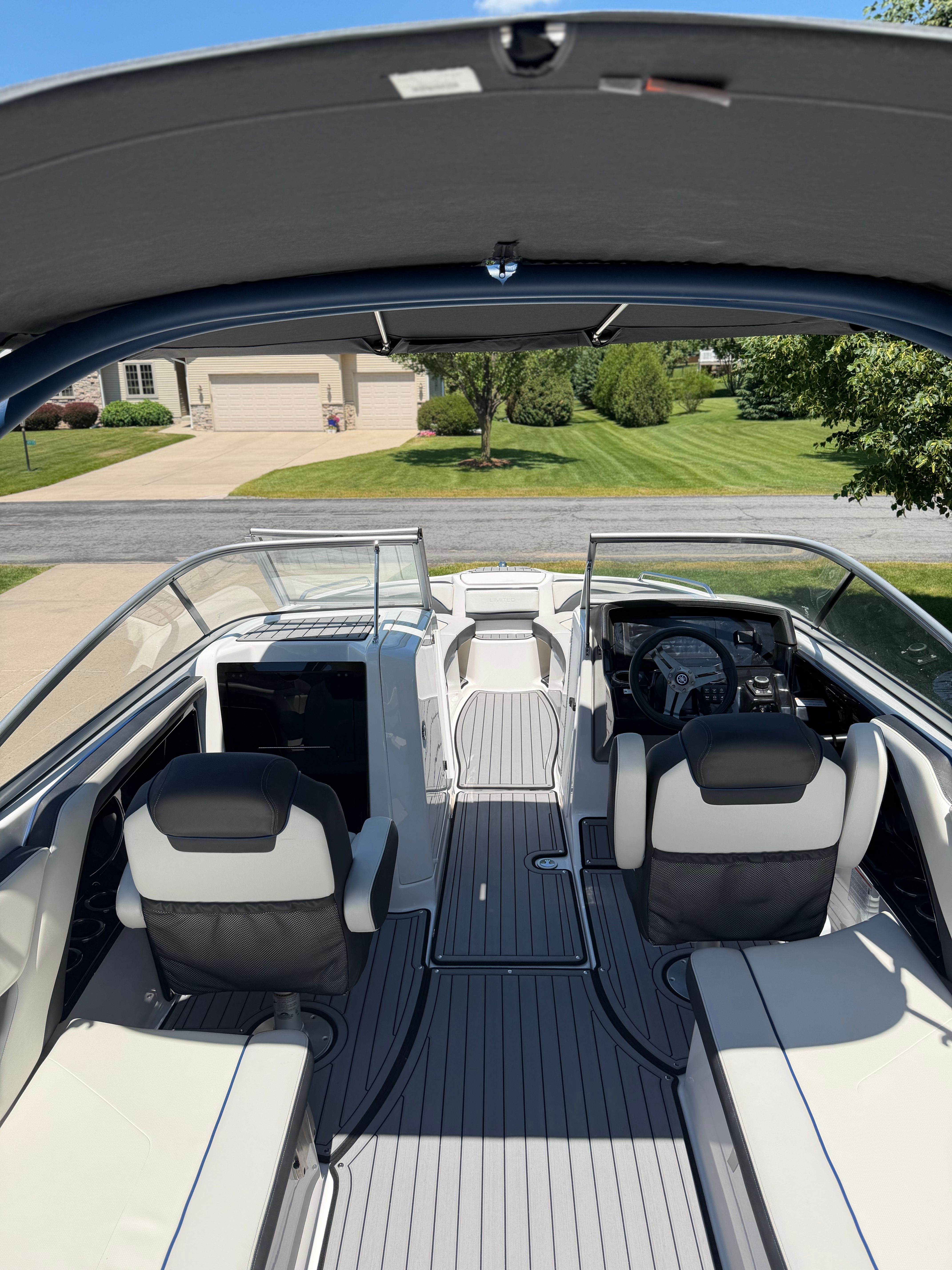 Interior view of a 2018 Yamaha 242 Limited S with sleek seating and a modern dashboard.