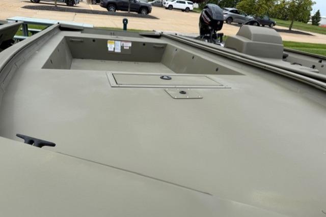 2025 Tracker Grizzly 1754 Jon boat, spacious deck, parked outdoors.