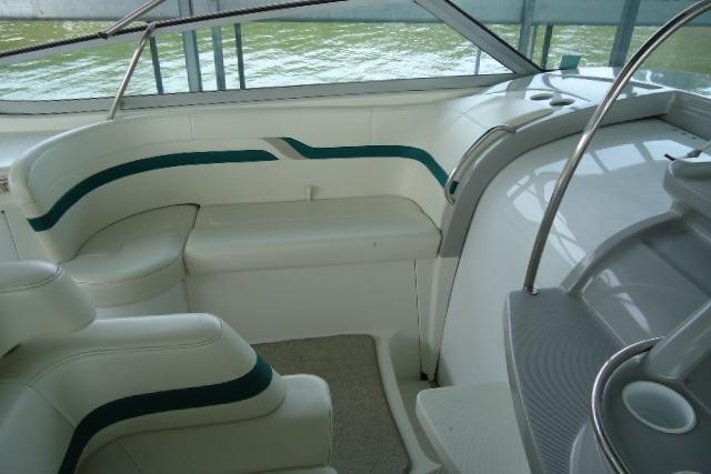 1999 Formula 400 Super Sport boat interior with white seating and green accents.