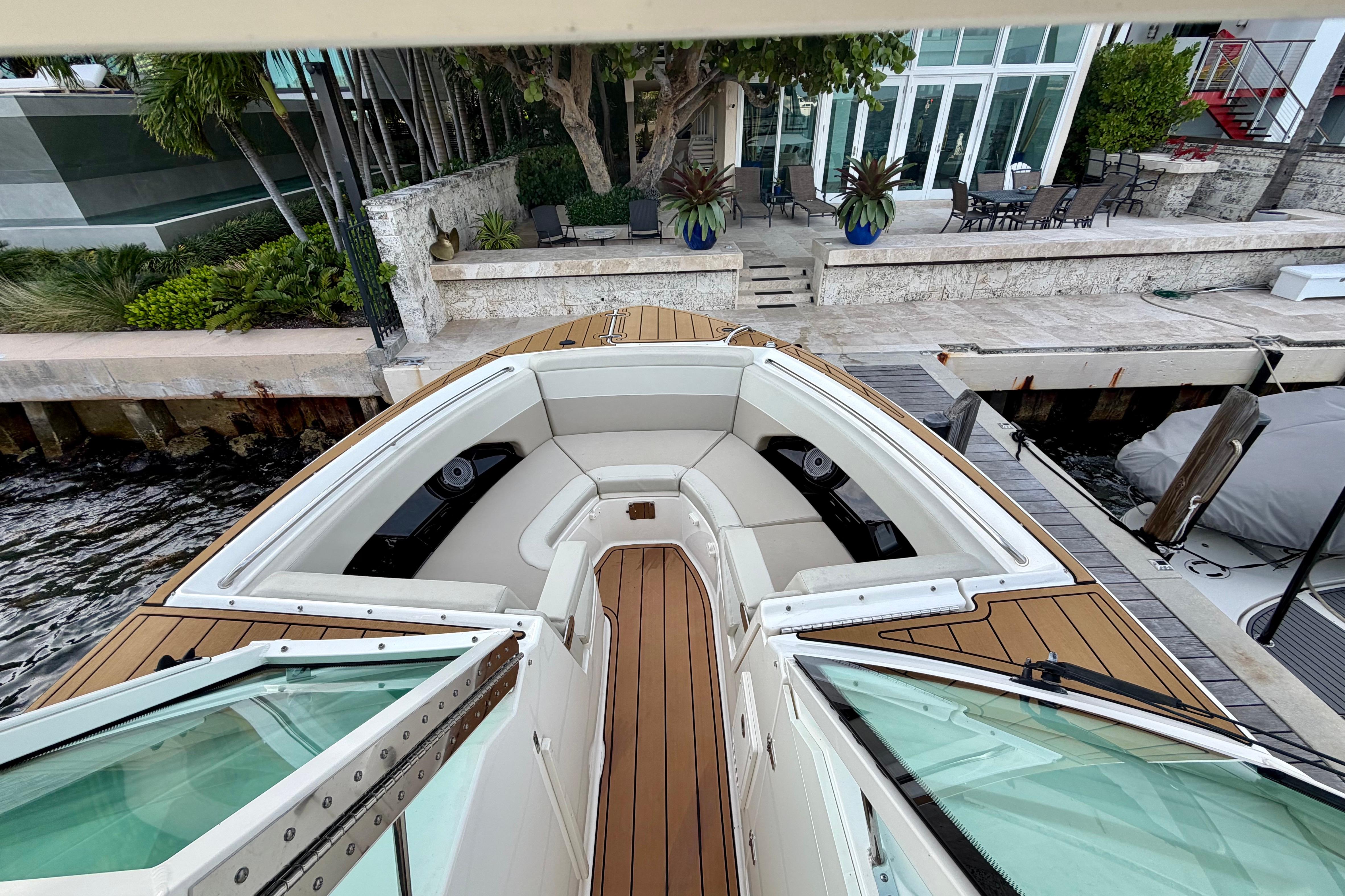 2022 Boston Whaler 280 Vantage boat docked, featuring spacious seating and elegant design.