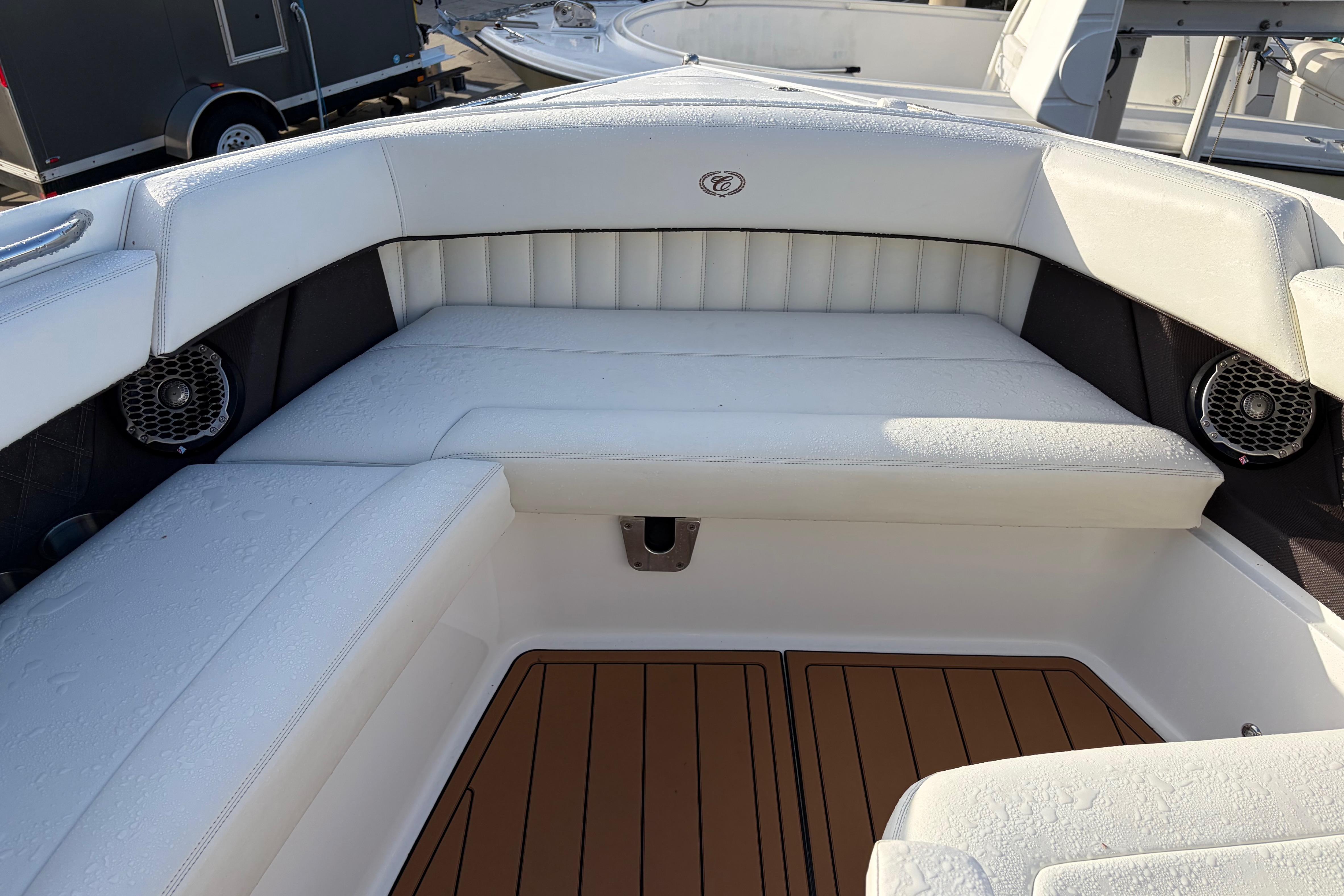 Luxurious seating area on a 2015 Cobalt 336 boat with white upholstery.