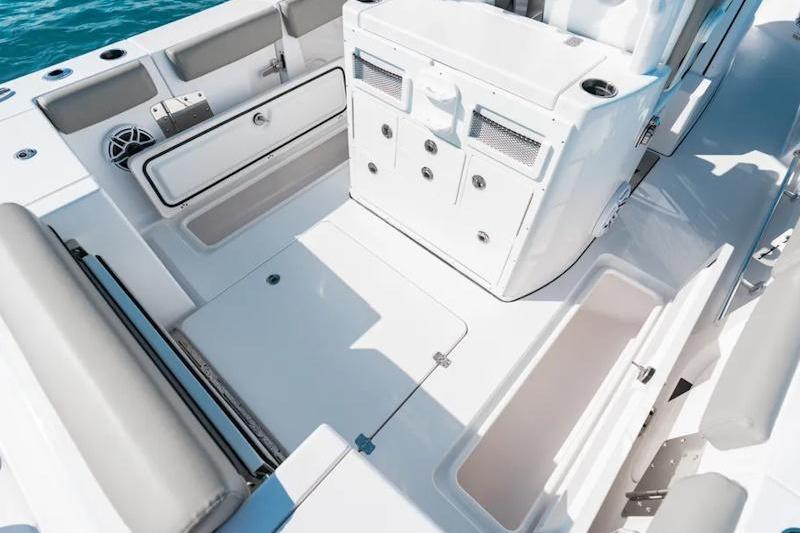 2026 Sportsman Open 282 Center Console boat interior with storage compartments and seating.