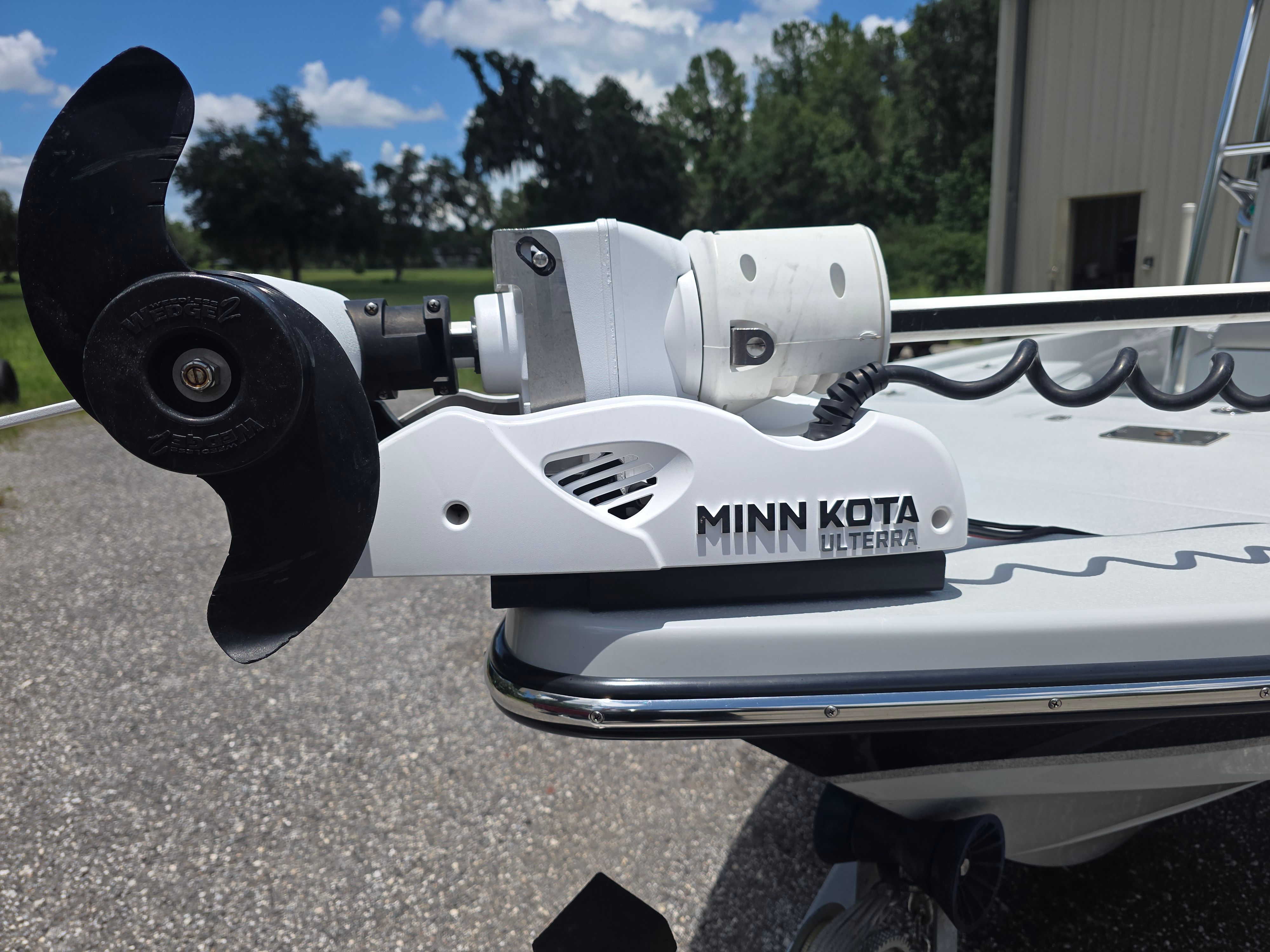 A Minn Kota Ulterra motor is mounted on the bow of a boat.