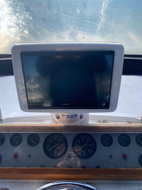 Dashboard of 1989 Ocean Alexander 42 yacht with navigation screen and gauges.