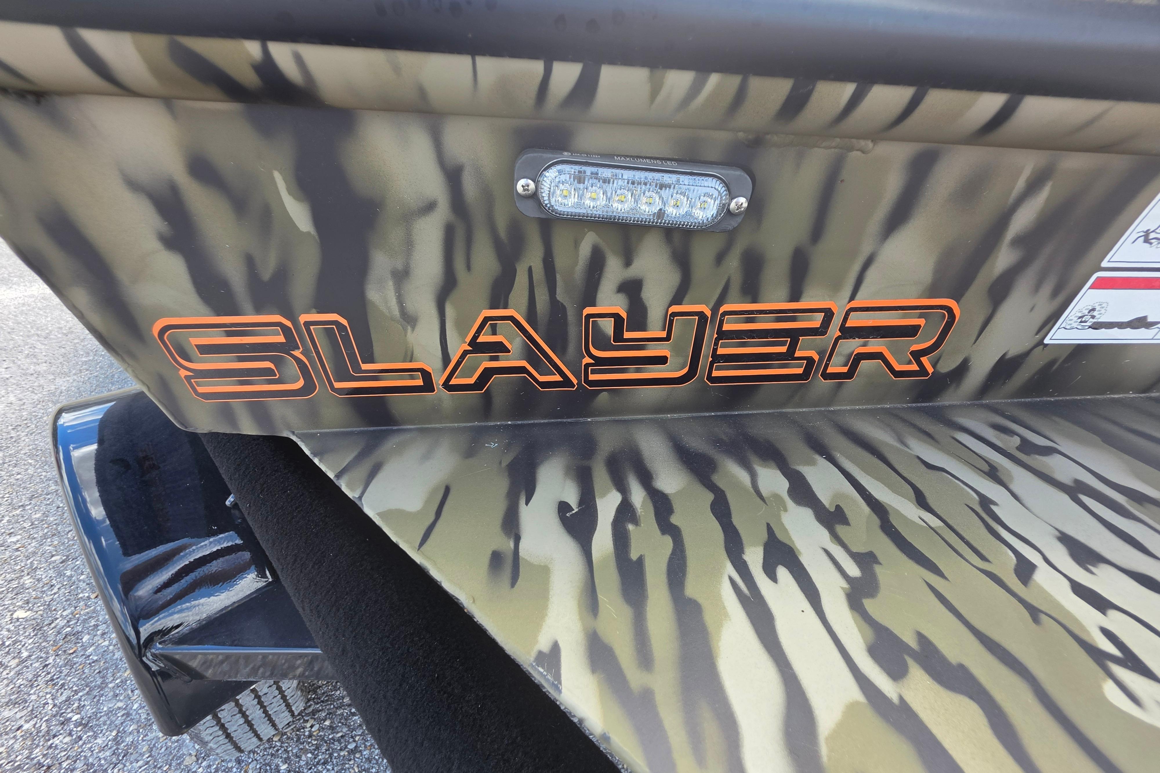 2025 SeaArk 1752 Slayer boat with camouflage design and bold orange lettering.