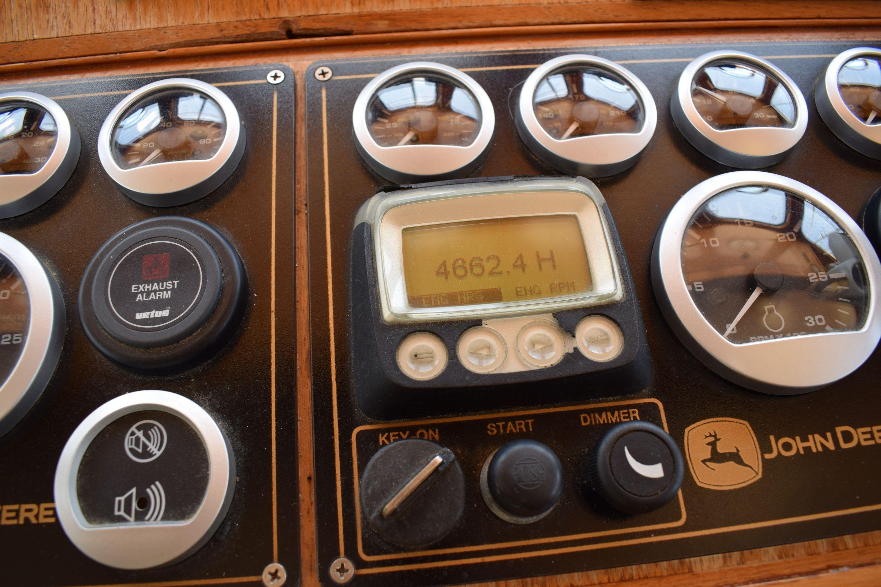 Instrument panel of a 1980 Cheoy Lee 52 Motorsailer with gauges and controls.