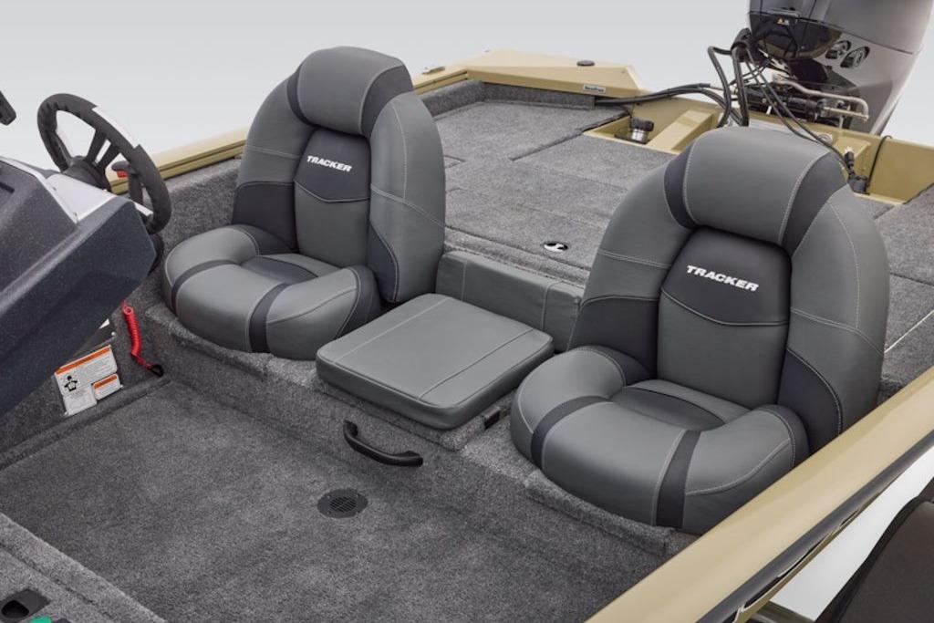 2026 Tracker Pro Team 175 boat interior with gray cushioned seats and steering wheel.