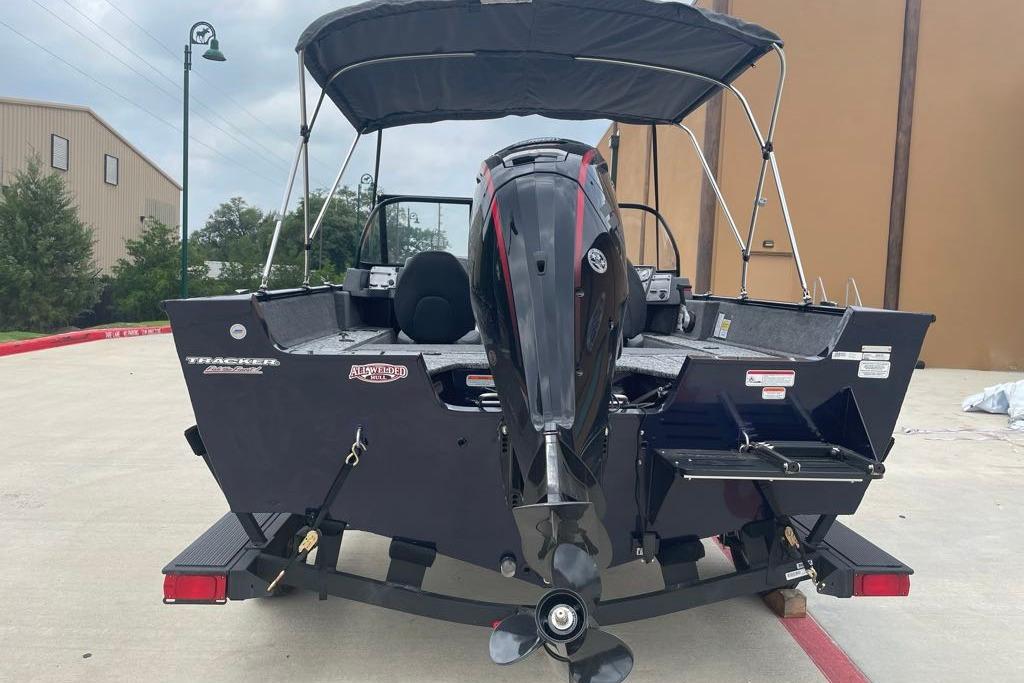 2026 Tracker Pro Guide V-175 Combo boat with outboard motor, parked on a trailer.