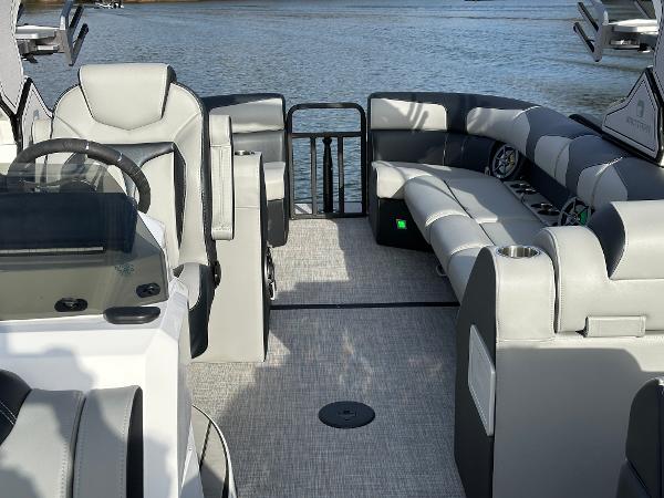 2025 Montara Surf Boss 2.0 25 interior with luxurious seating on a calm lake.