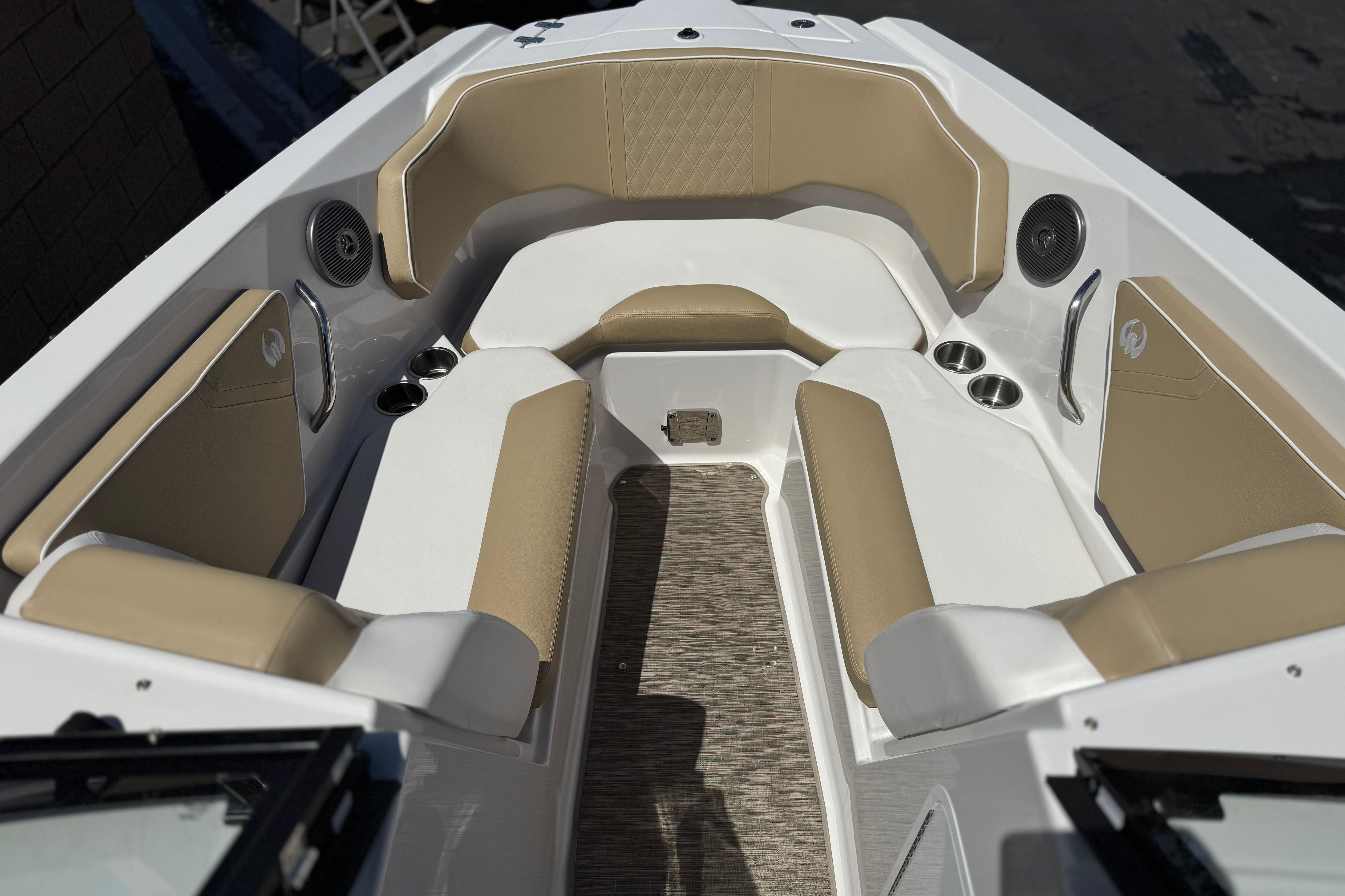 2017 Scarab 255 H.O. Platinum boat interior with beige seating and cup holders.