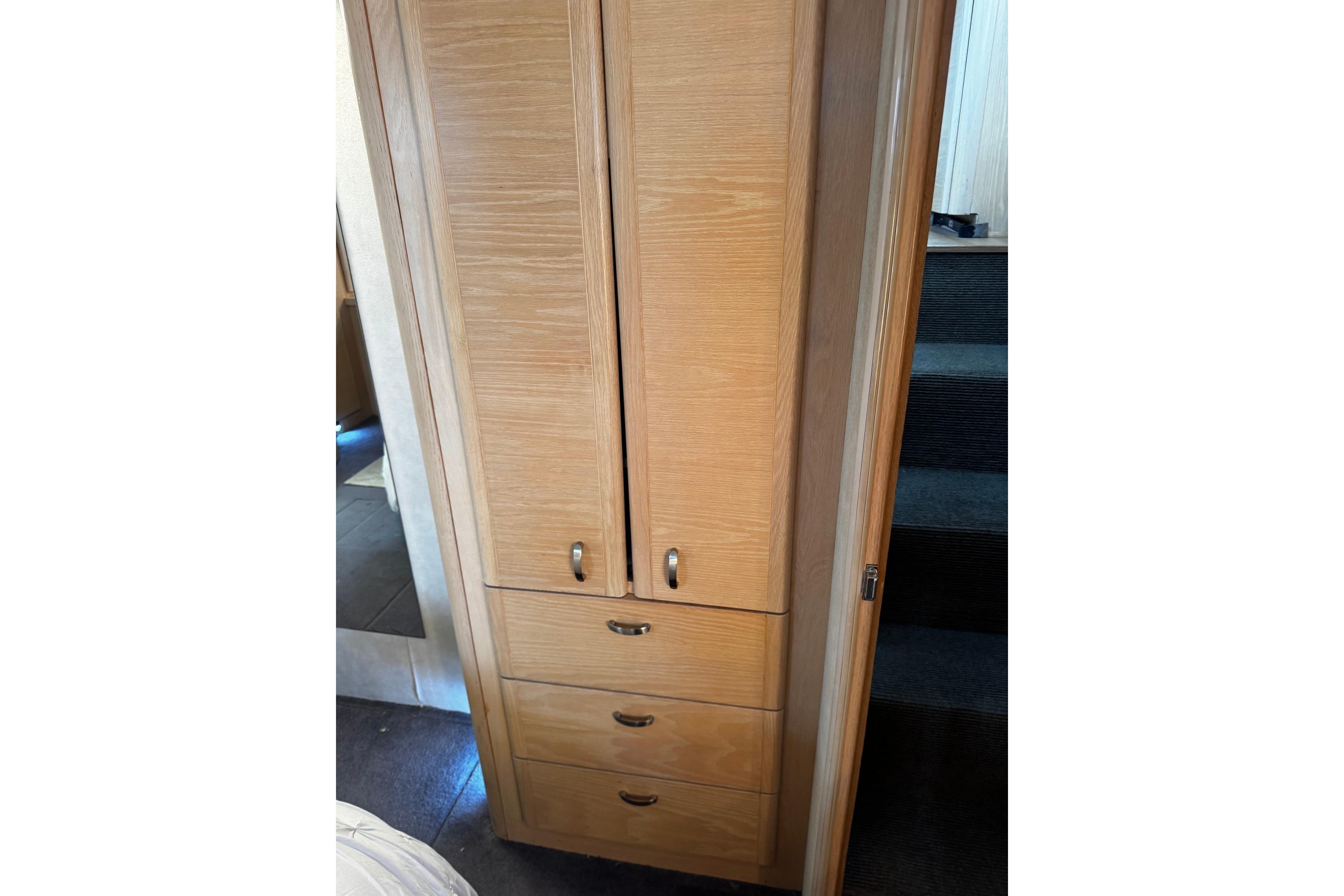 Wooden cabinet with drawers inside a 1991 Silverton 46 Motor Yacht.