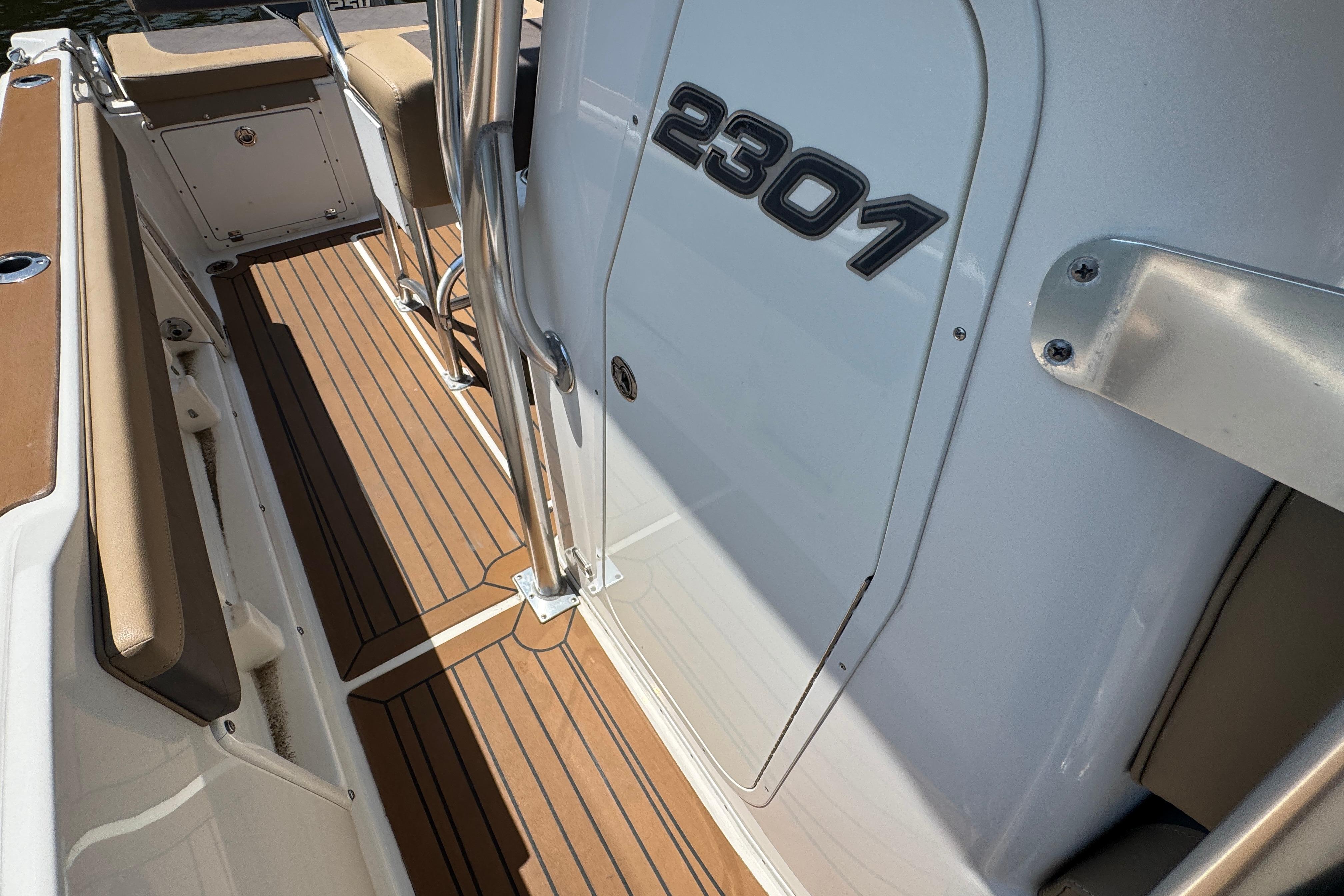 2014 Century 2301 Center Console boat with teak flooring and sleek design.