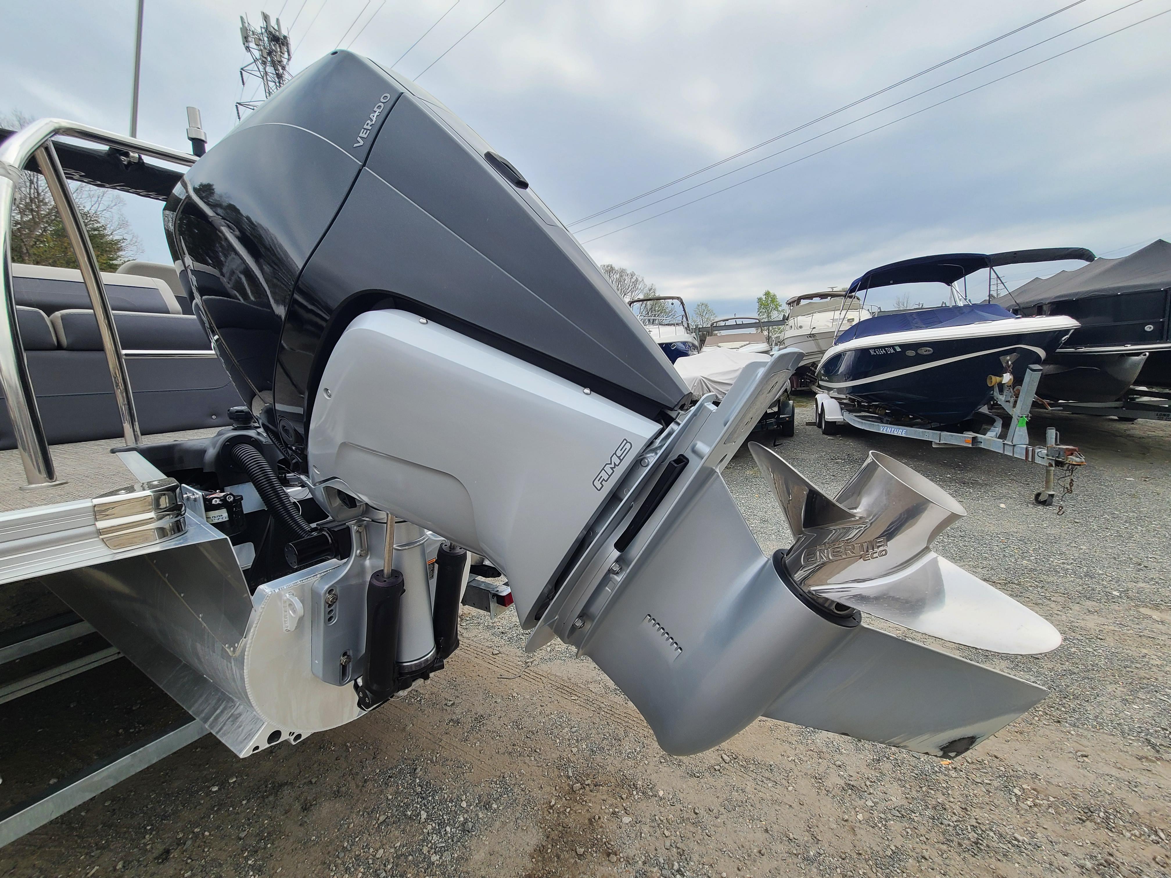 2022 Barletta CORSA 25UC boat with powerful outboard motor in a marina.