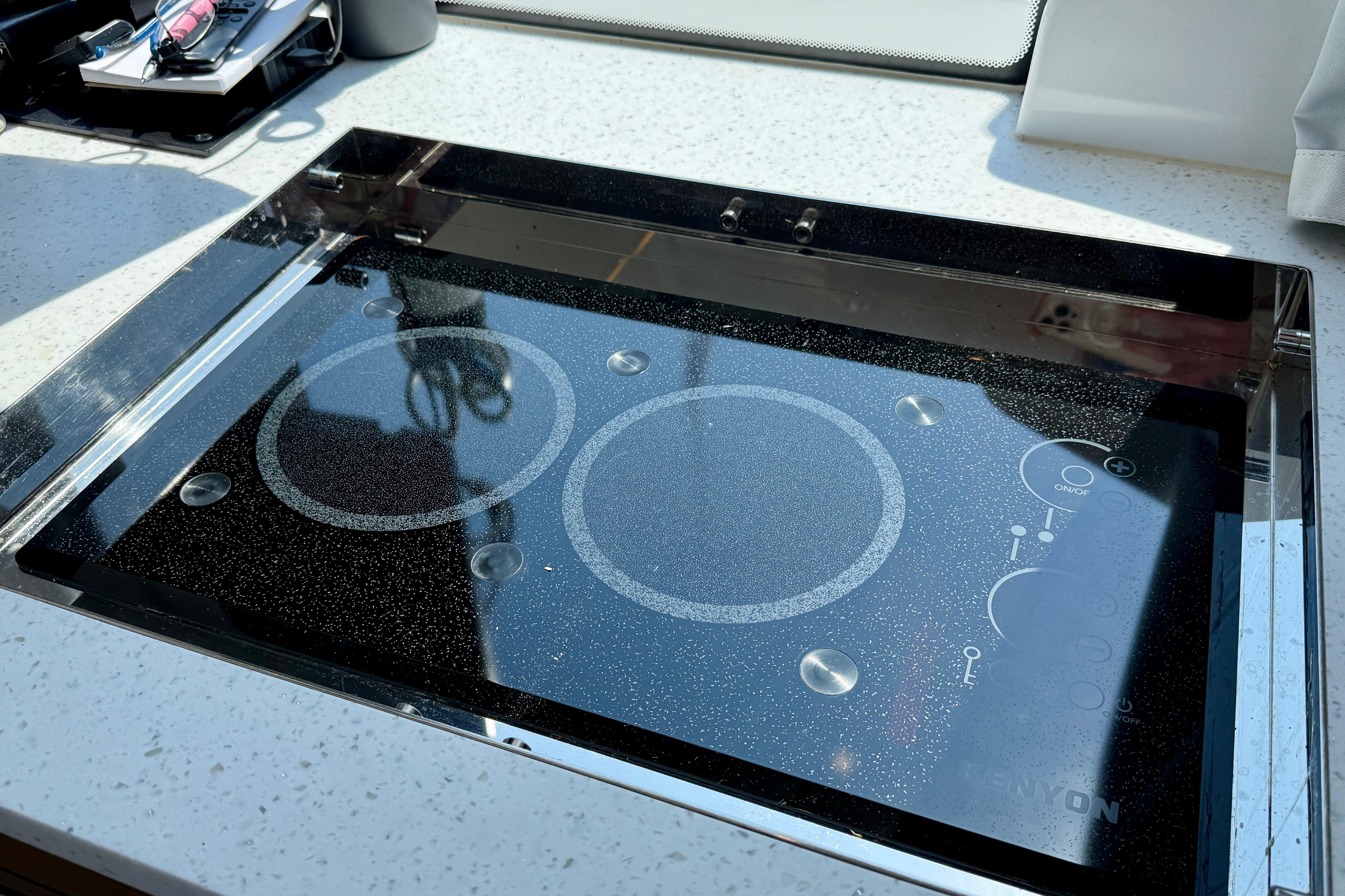 Modern induction cooktop on Jeanneau NC 1095 Fly 2022 yacht kitchen.