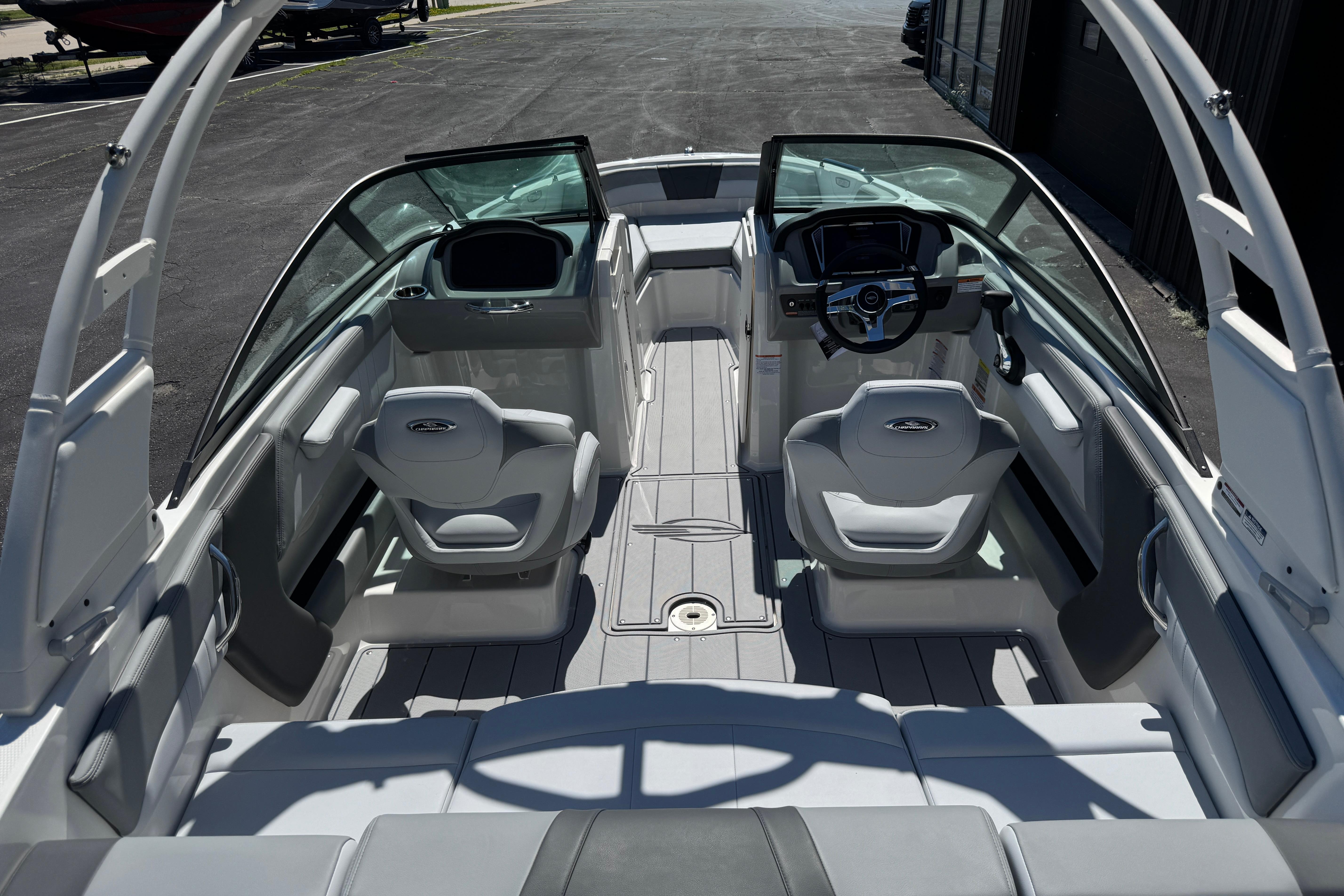 2026 Chaparral 21 SSi boat interior with modern seating and sleek dashboard design.