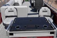 2026 Sun Tracker SportFish 22 DLX interior with seating and table setup.