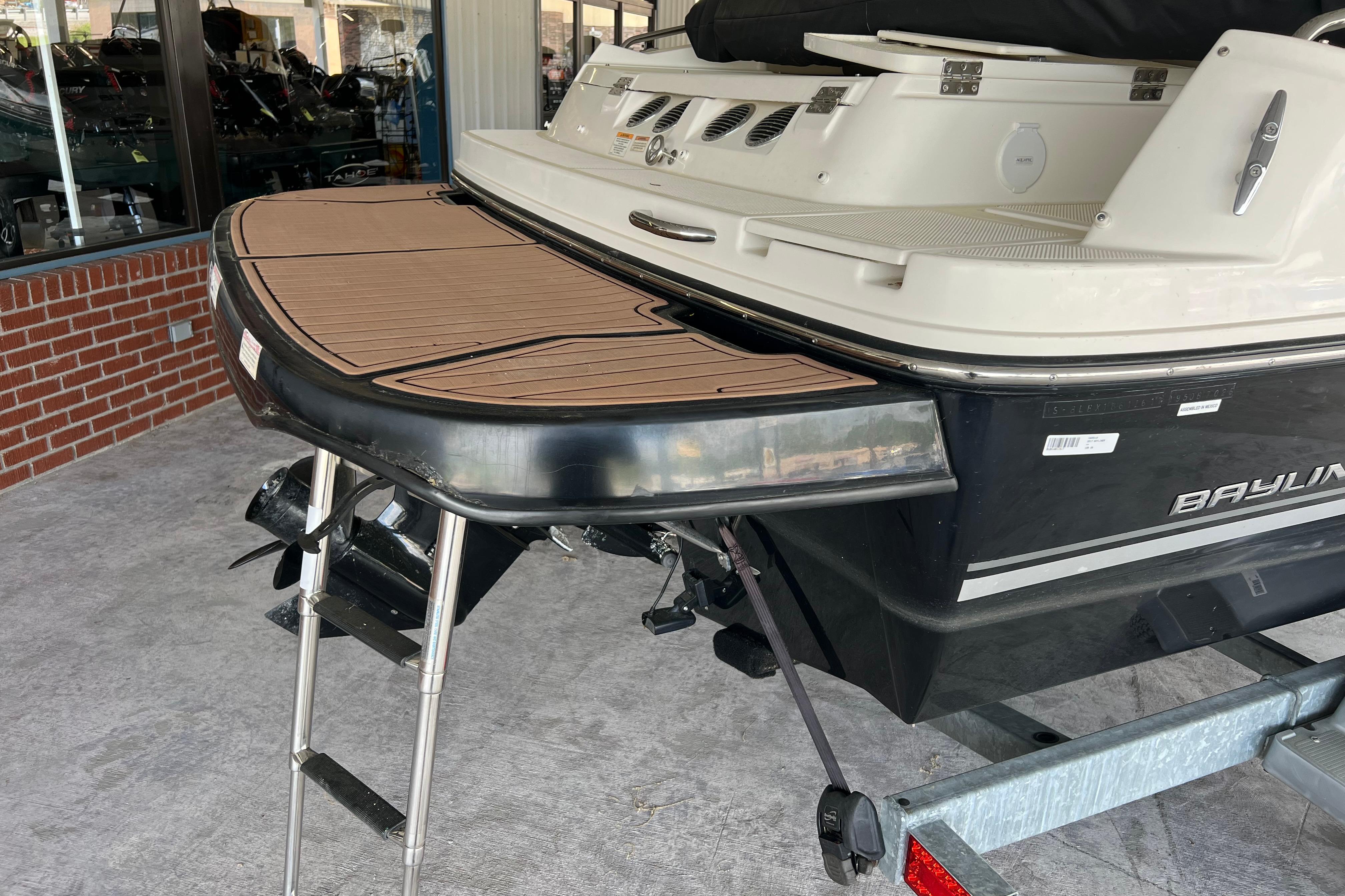 2017 Bayliner 195 Deck Boat rear view with swim platform and ladder.