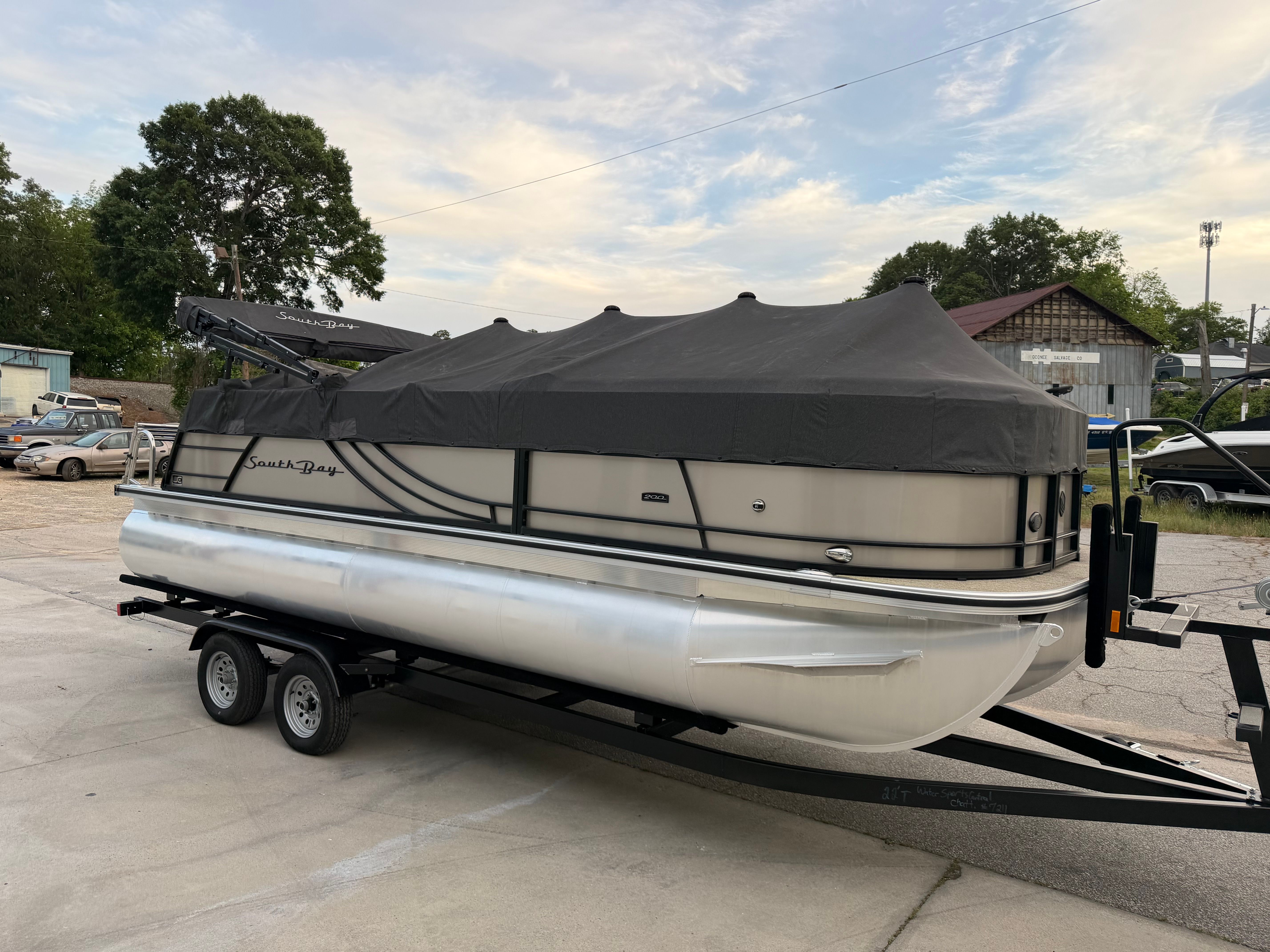 2023 South Bay S222 CR2 pontoon boat with cover on trailer.