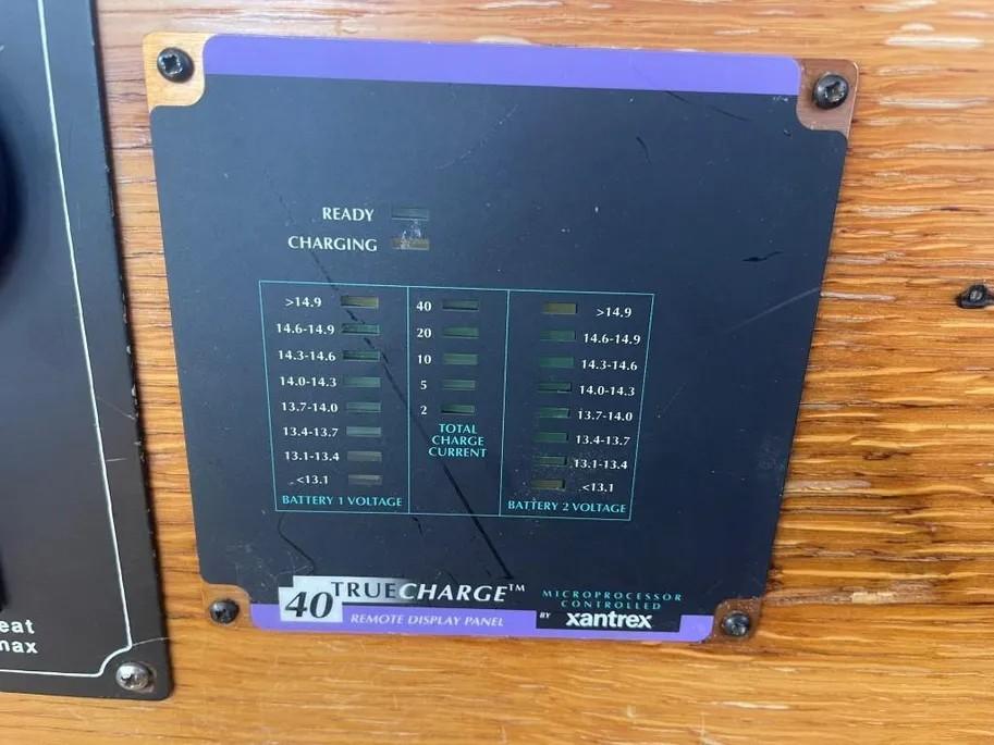 Xantrex TrueCharge 40 remote display panel on 1985 Princess Sedan Flybridge, showing battery voltage and charge status.