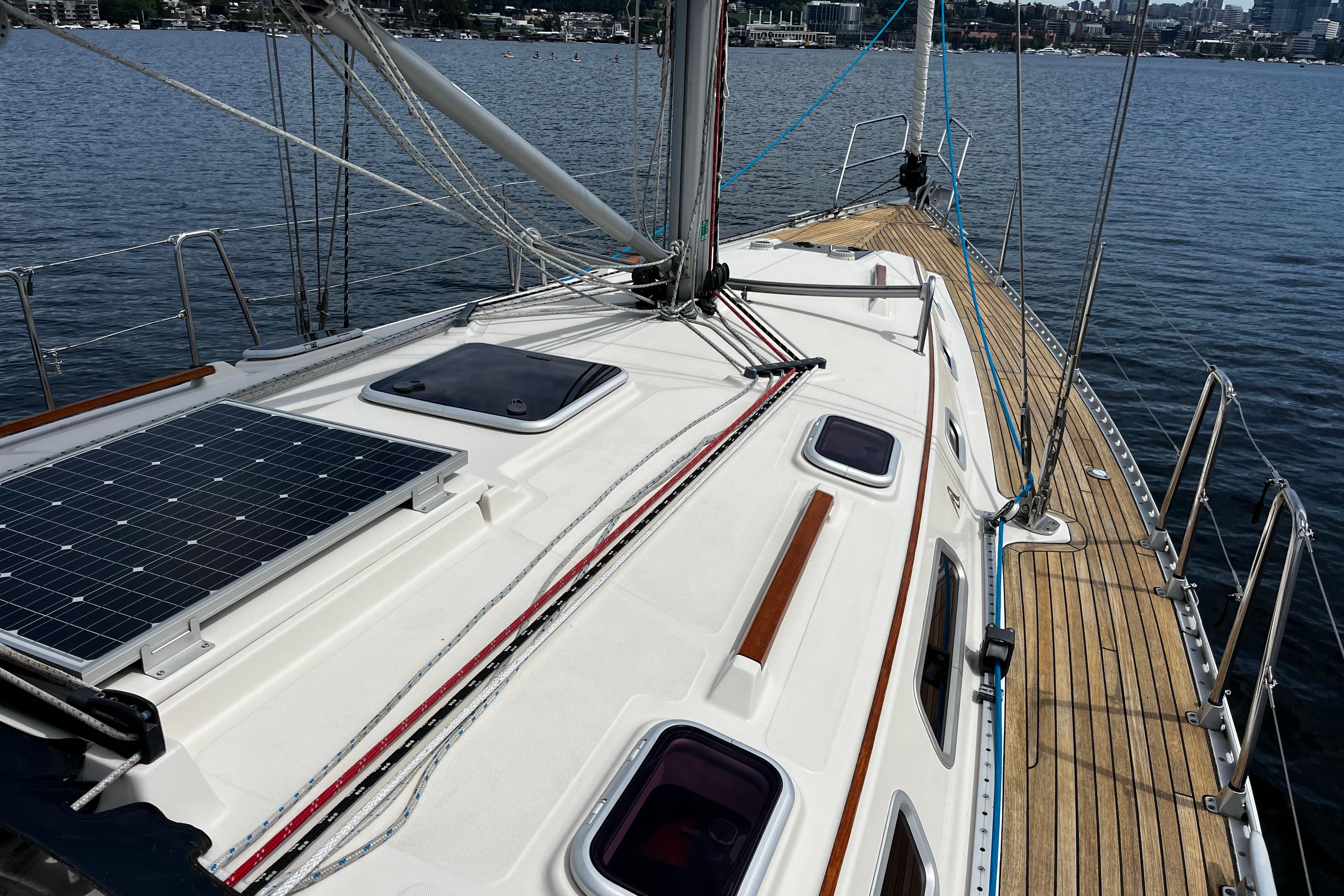 2004 Hanse 411 sailboat deck with solar panel, moored on calm water.