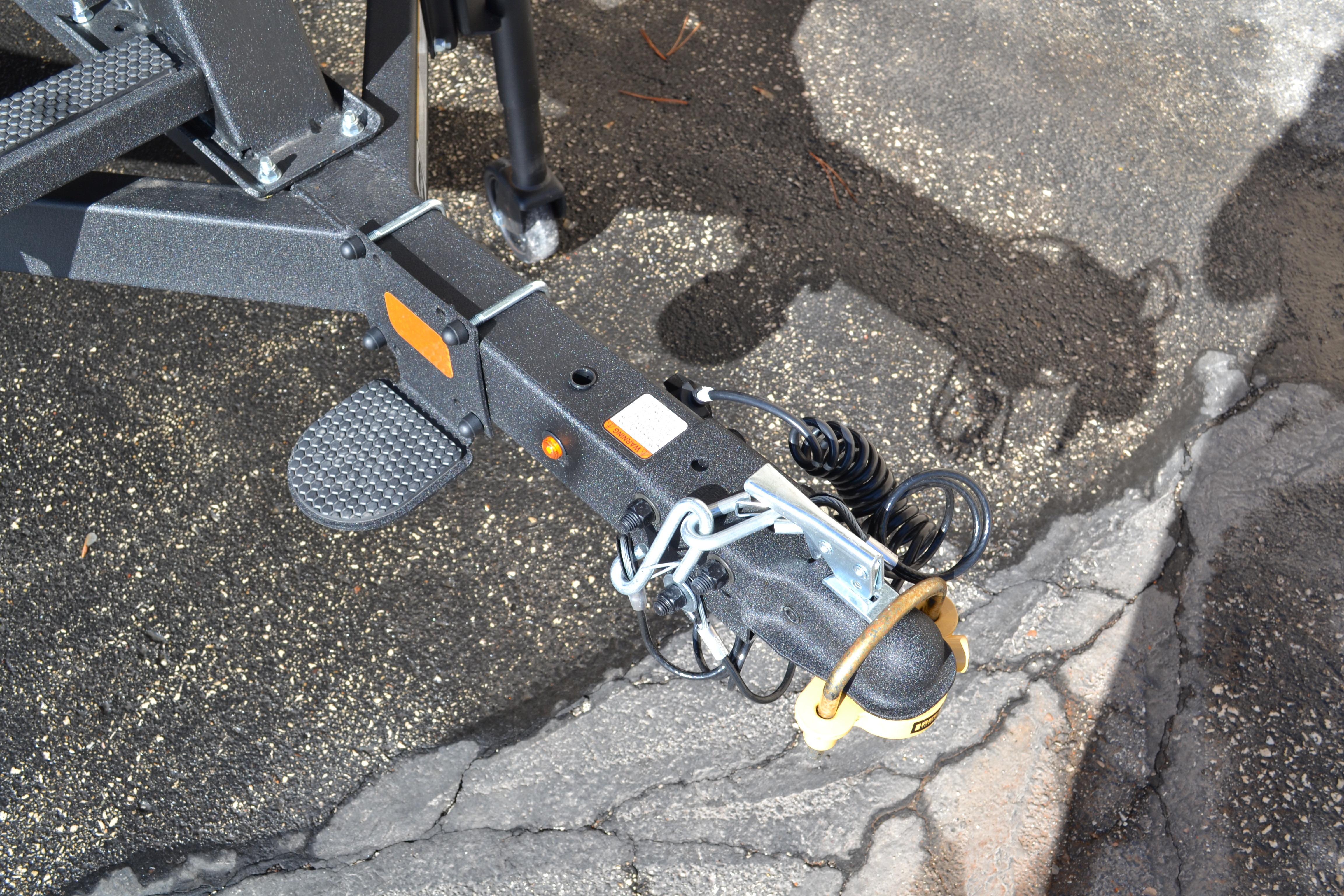 Trailer hitch of 2026 Sun Tracker Bass Buggy 16 XL Select on asphalt surface.