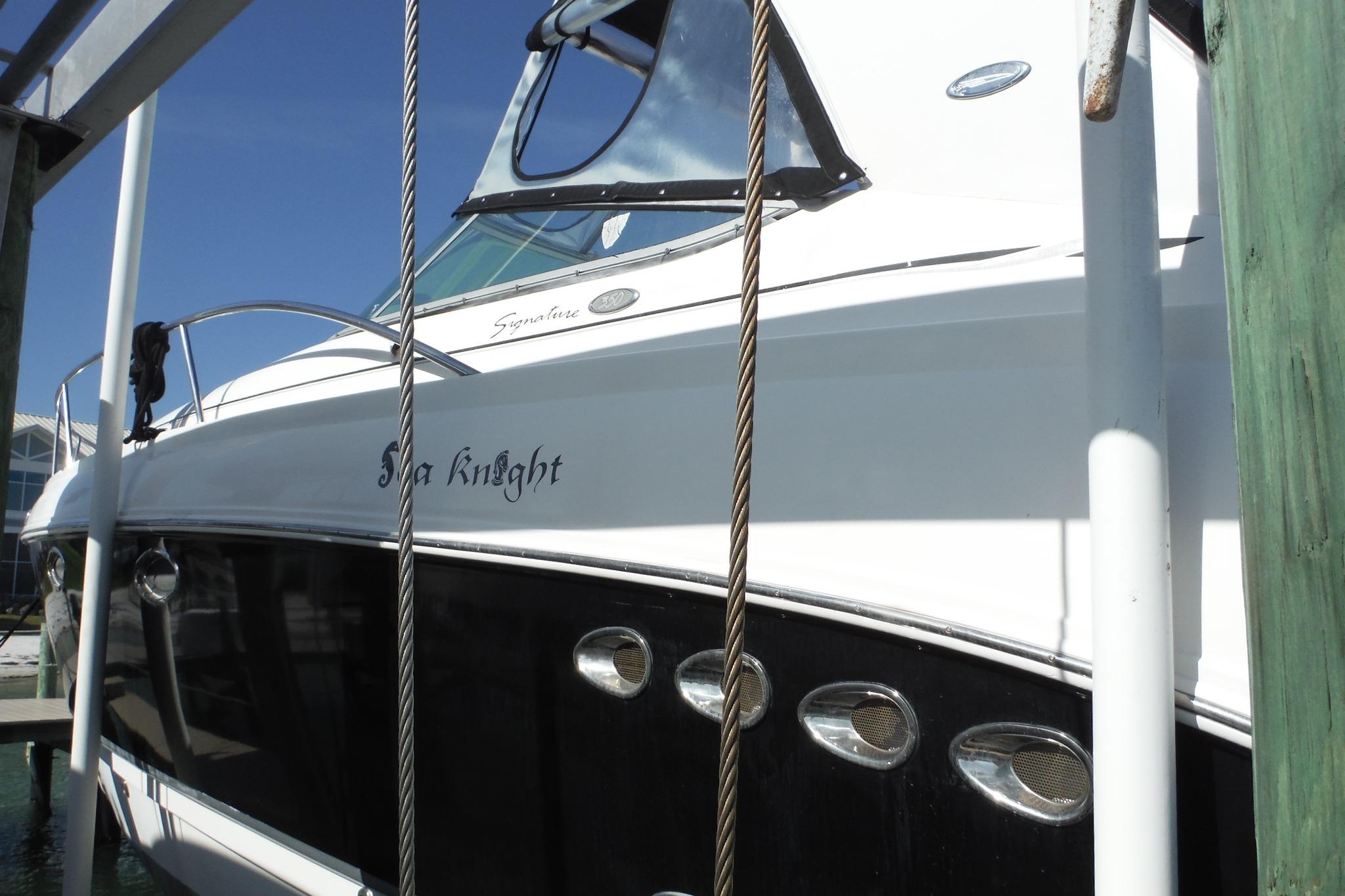2005 Chaparral Signature 350 boat docked, featuring sleek design and elegant detailing.