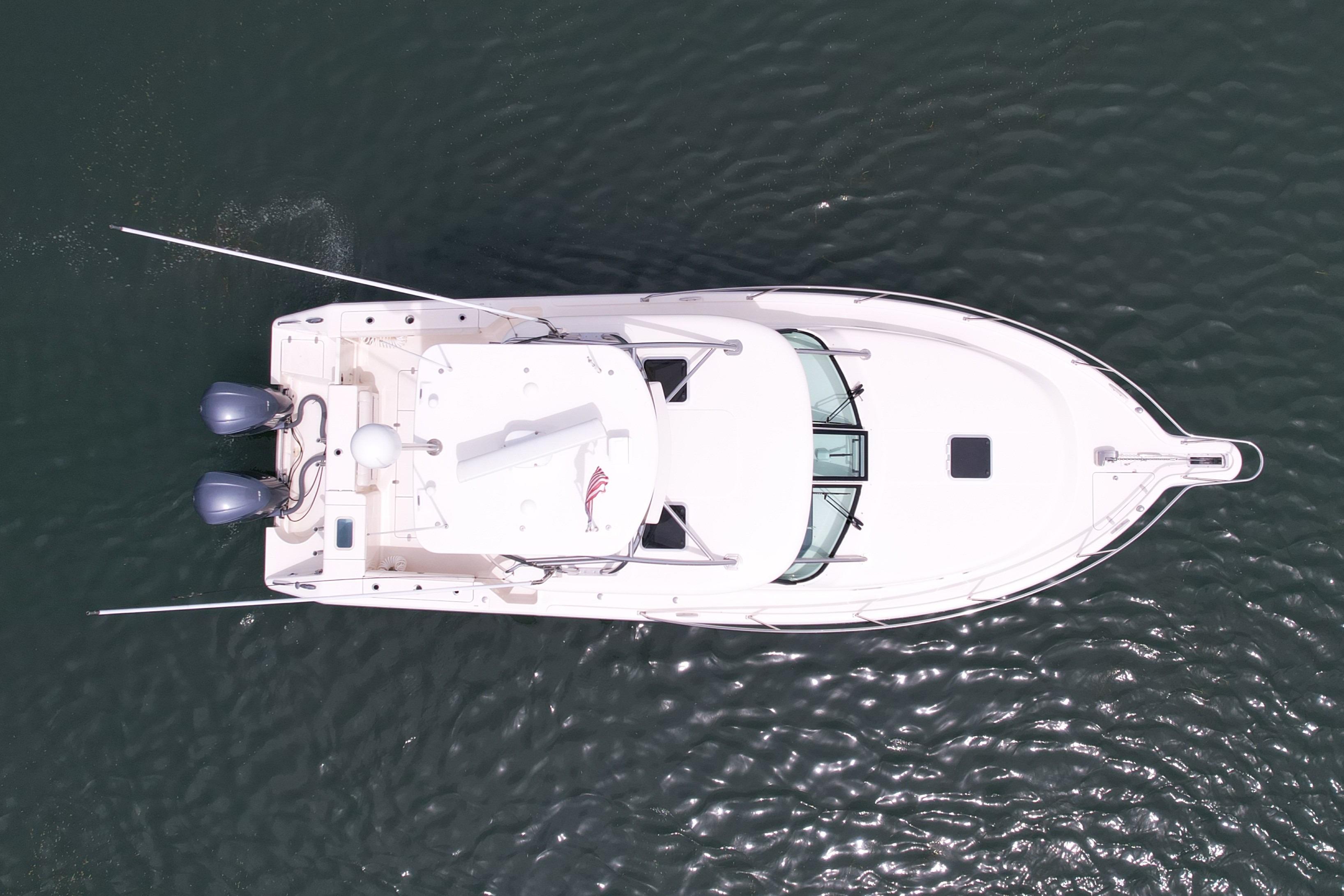 Aerial view of 2012 Pursuit OS 345 Offshore boat on water.